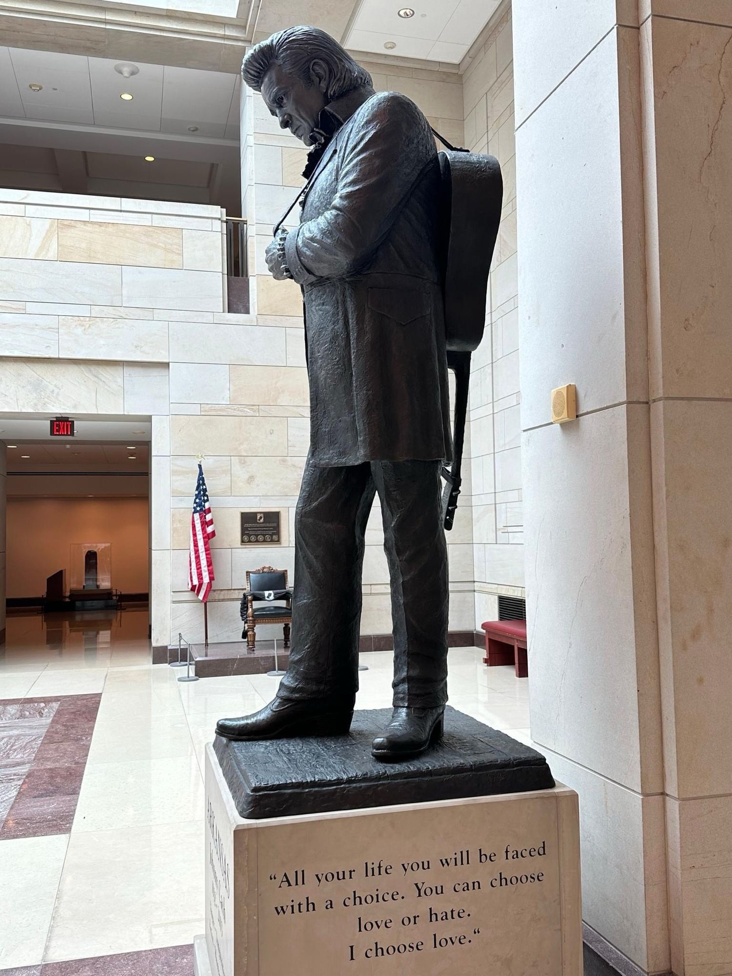 Side view (Johnny Cash has his guitar slung over his shoulder); the inscription reads “All your life you will be faced with a choice. You can choose love or hate. I choose love.”