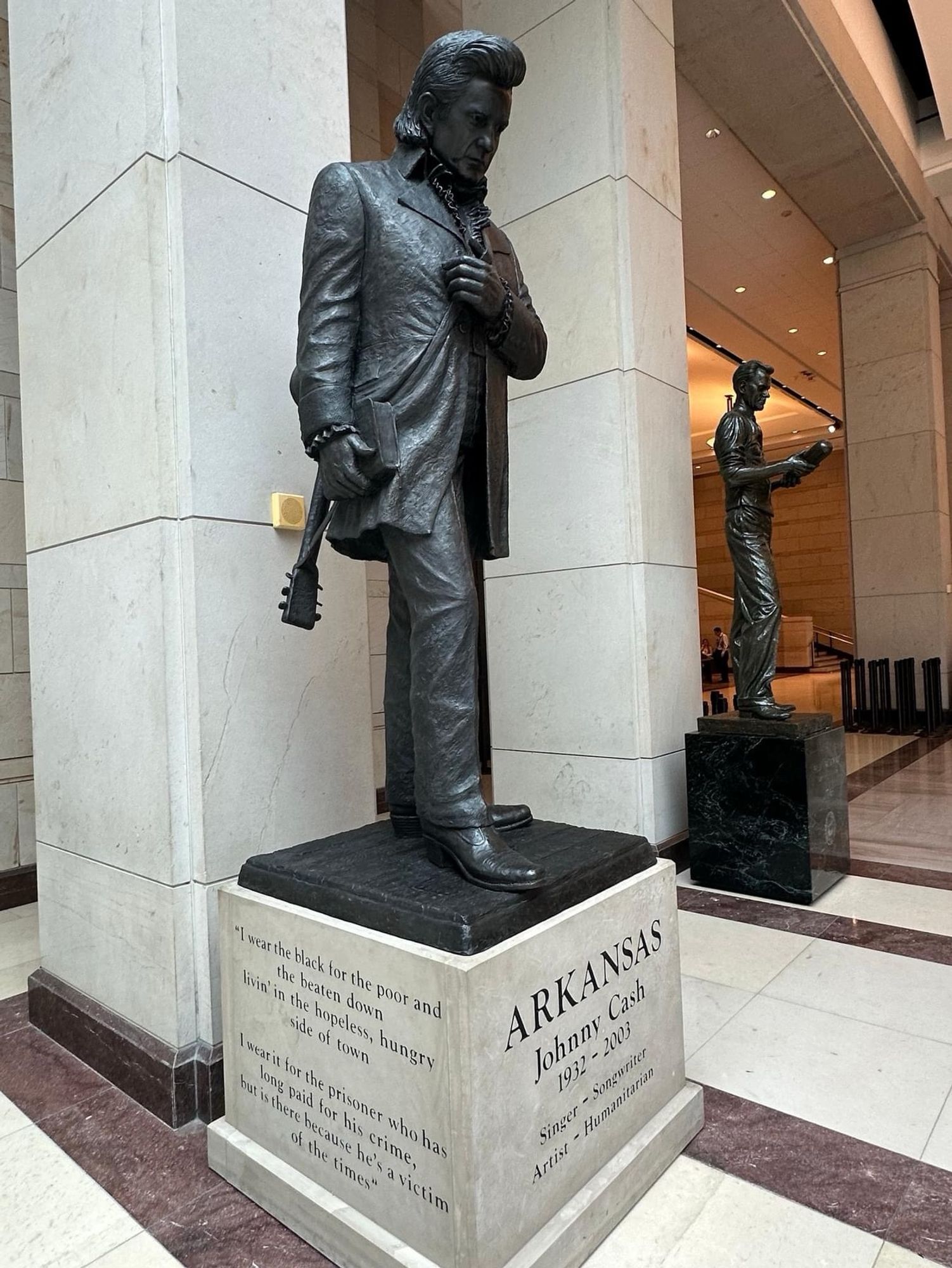 Statue of Johnny Cash, who was born in Arkansas, that was just placed in the U.S. Capitol as one of the state’s two allotted statues.

Inscription on the side: I wear the black for the poor and the beaten down
livin' in the hopeless, hungry side of town
I wear it for the prisoner who has long paid for his crime,
but is there hecause he's a victim of the times

Inscription on front: 
ARKANSAS
Johnny Cash
1932 - 2003
Singer - Songwriter
Artist - Humanitarian