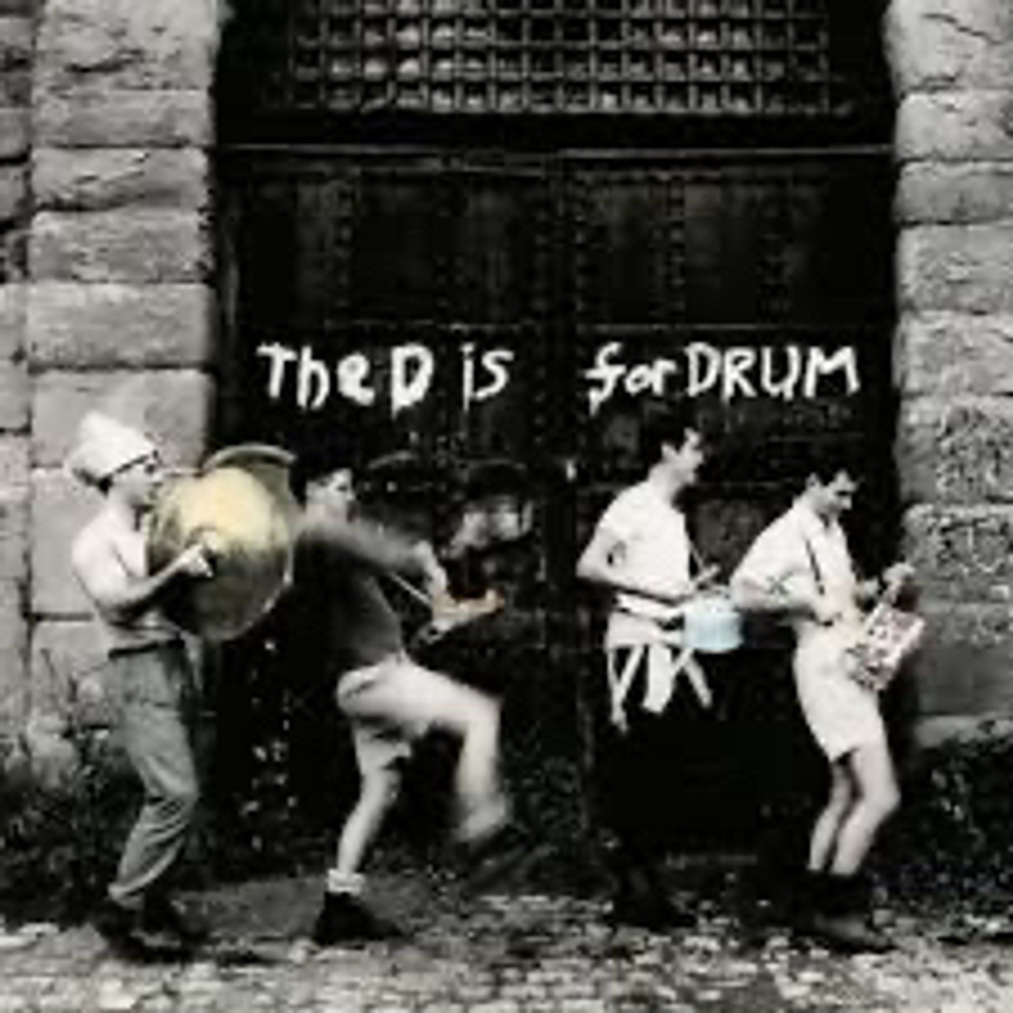 Four men dancing across an old black door carrying various percussion instruments