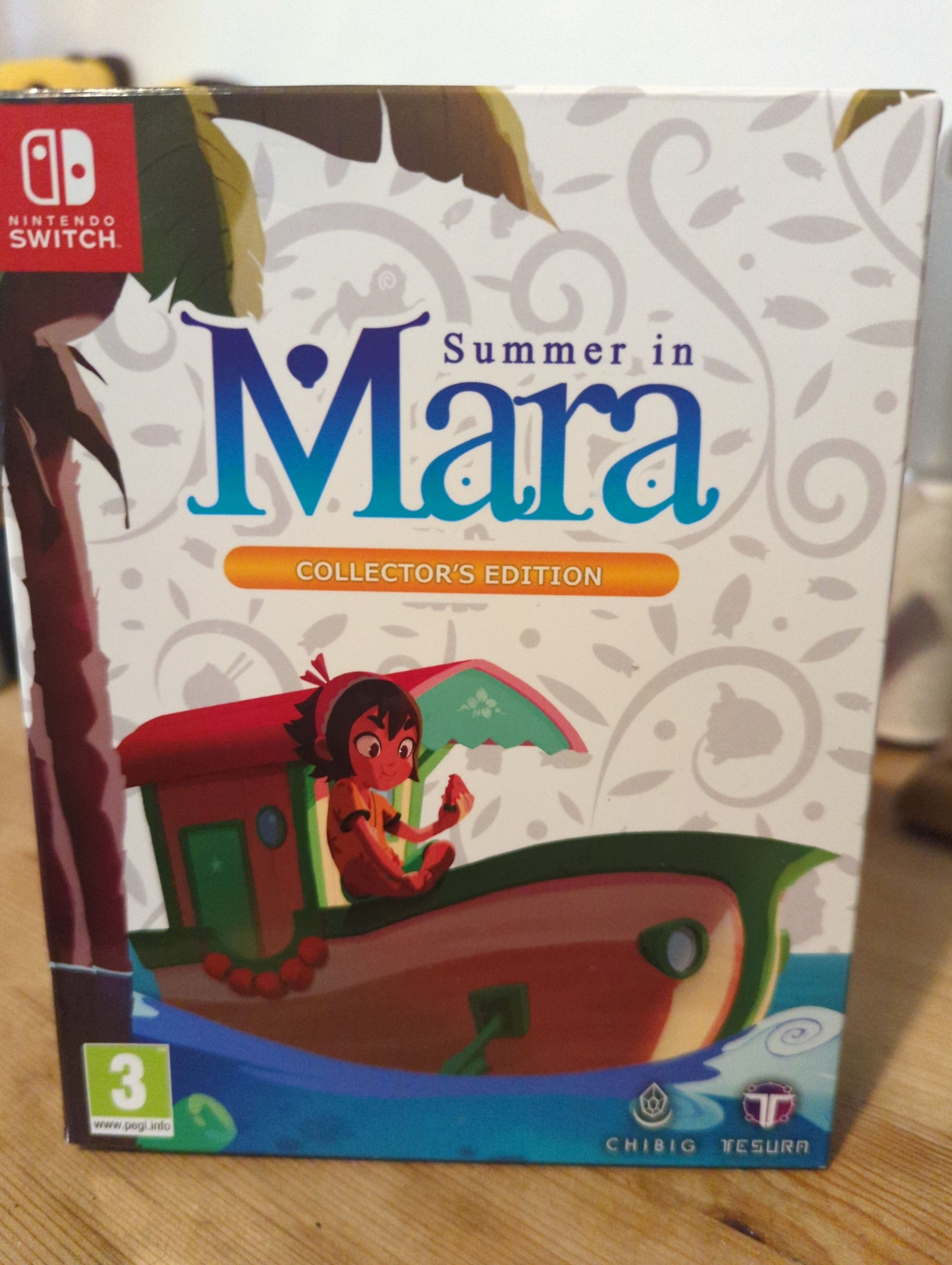 It's a Nintendo Switch Collectors Edition version of the game Summer in Mara. The box shows the main character Koa on her boat with a palm tree nearby.