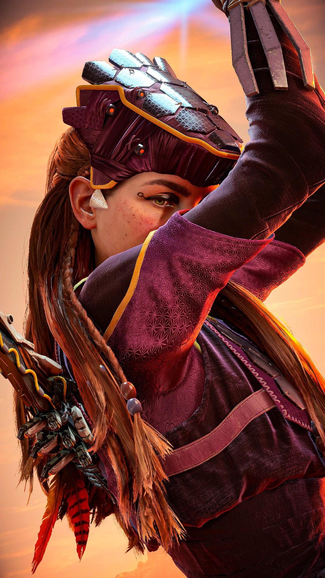 A close up of Aloy looking over her shoulder as she holds on to her Shieldwing Glider.