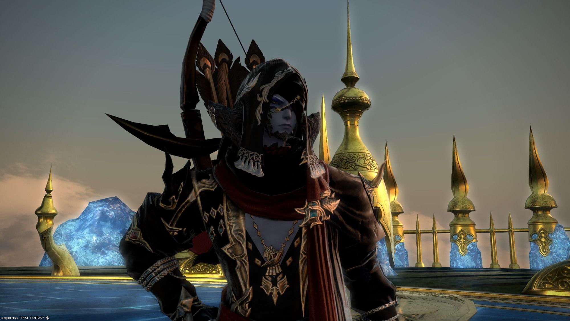 a hooded man with a gratuitous boob window stands framed amidst gold and blue crystal at sunset.