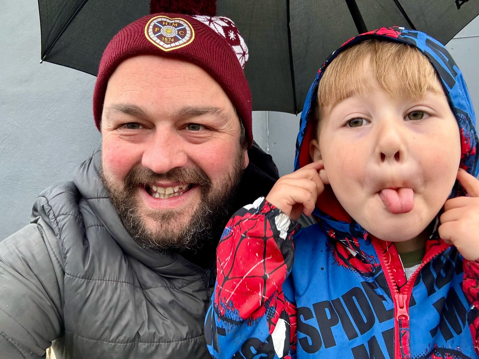 Me and my son making faces at the football