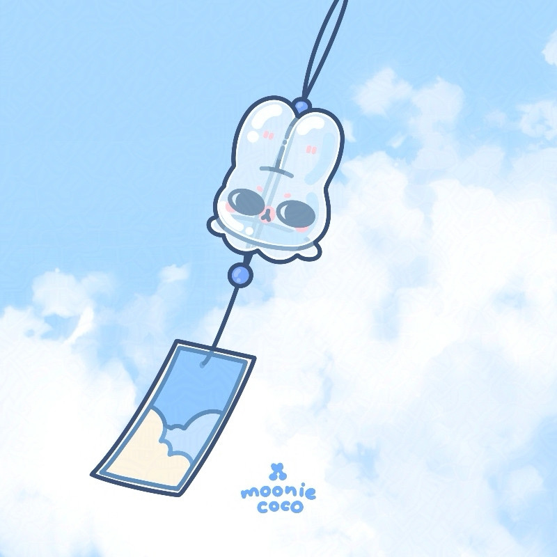 Wind chime in a form of bunny head, the background is blue sky, white clouds