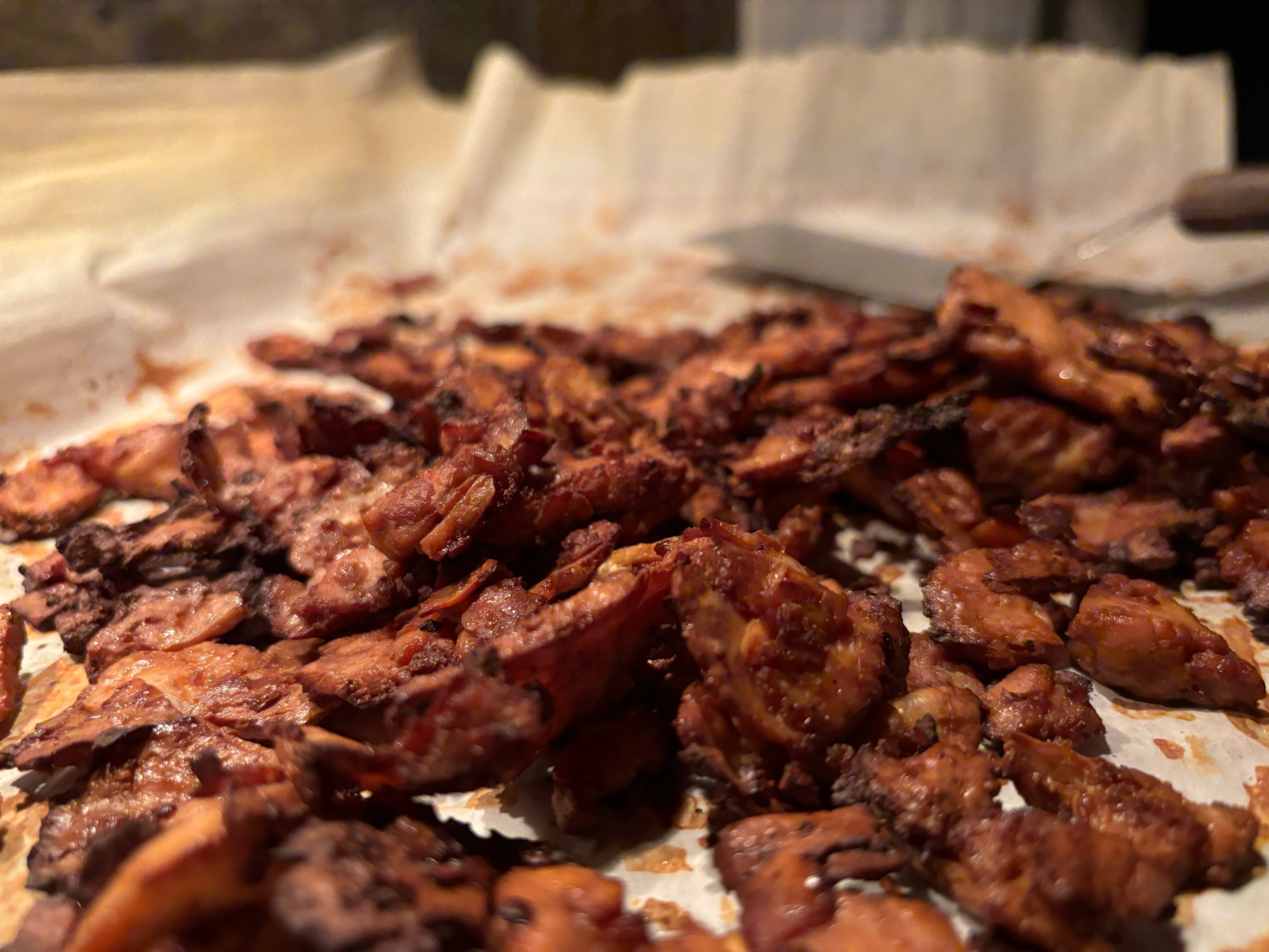 Sheet pan covered with thin crispy and salty tofu ‘bacon’