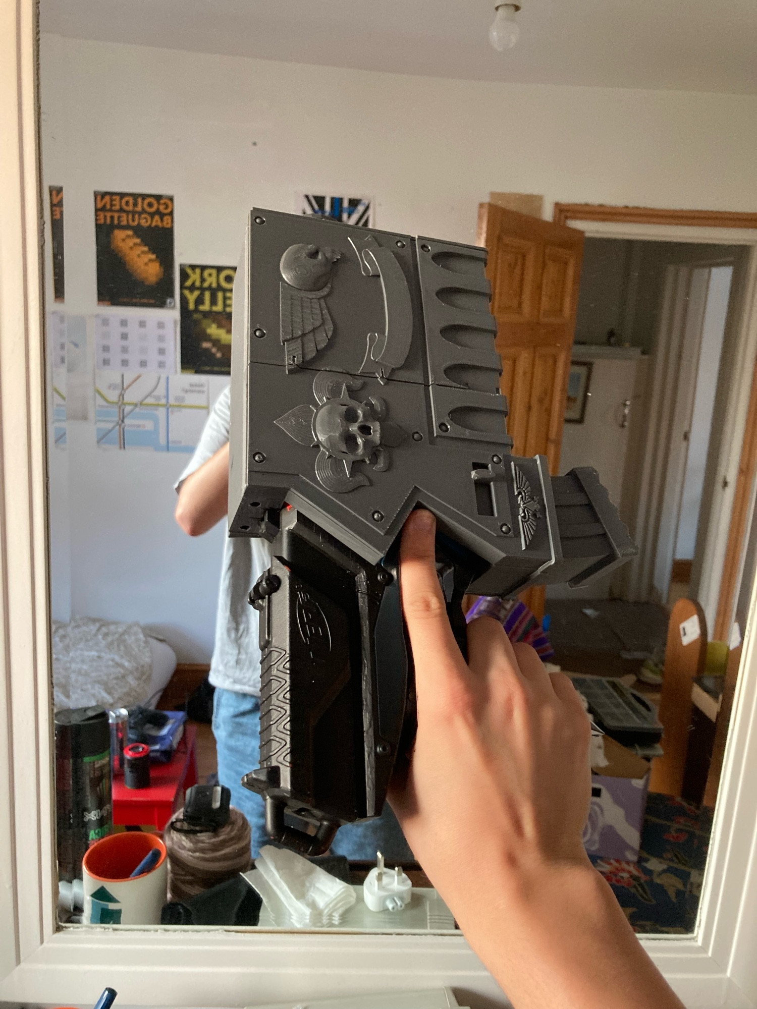 Said gun is now painted black apart from the new 3D printed parts screwed on to make it look like a Bolter from Warhammer 40K