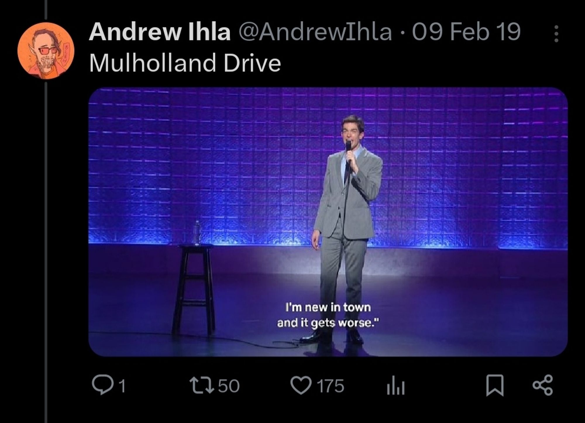 Screenshot of a tweet from the account @andrewihla, featuring a still of John Mulaney saying "I'm new in town and it gets worse." and the caption "Mulholland Drive"