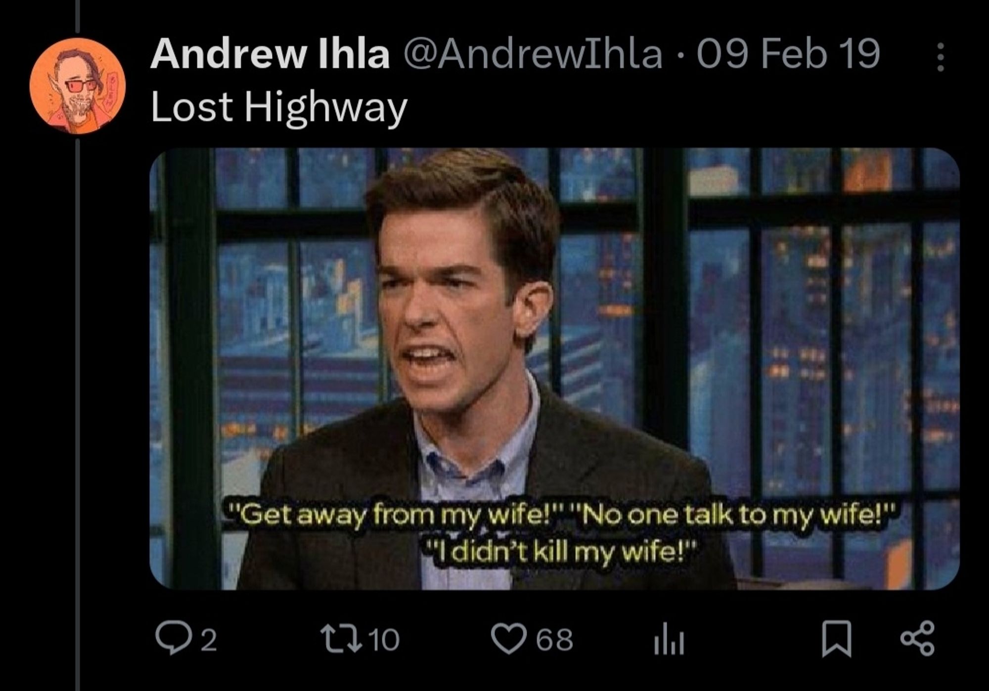 Screenshot of a tweet from the account @andrewihla, featuring a still of John Mulaney saying "Get away from my wife! No one talk to my wife! I didn't kill my wife!" and the caption "Lost Highway"