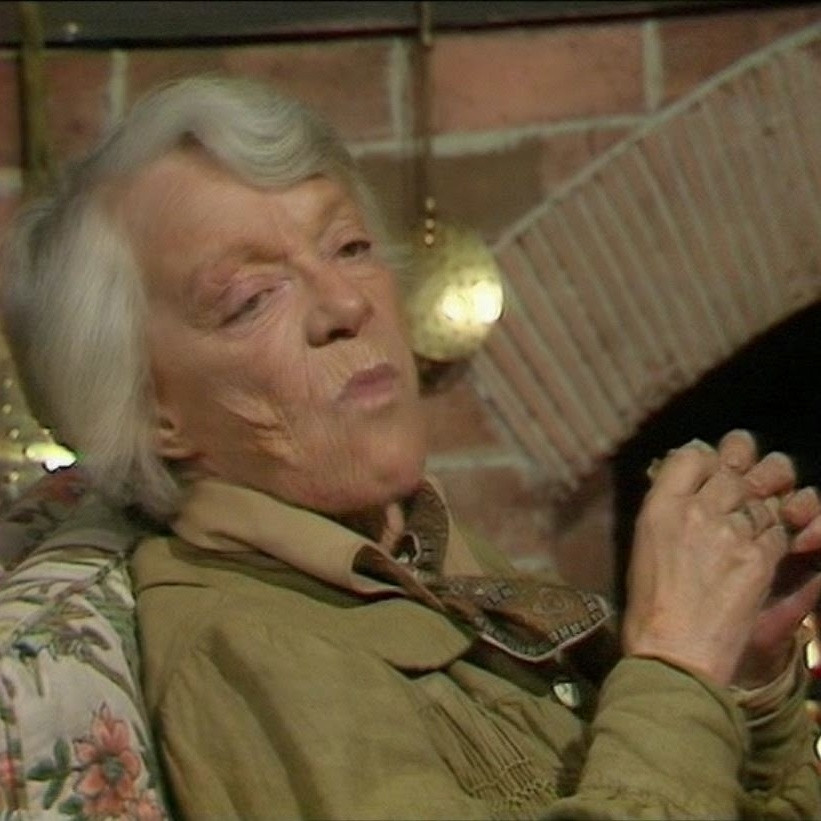 Professor Amelia Rumford from Doctor Who's "The Stones of Blood" (1978), demolishing a sausage sandwich like Henry VIII going to town on the monasteries.