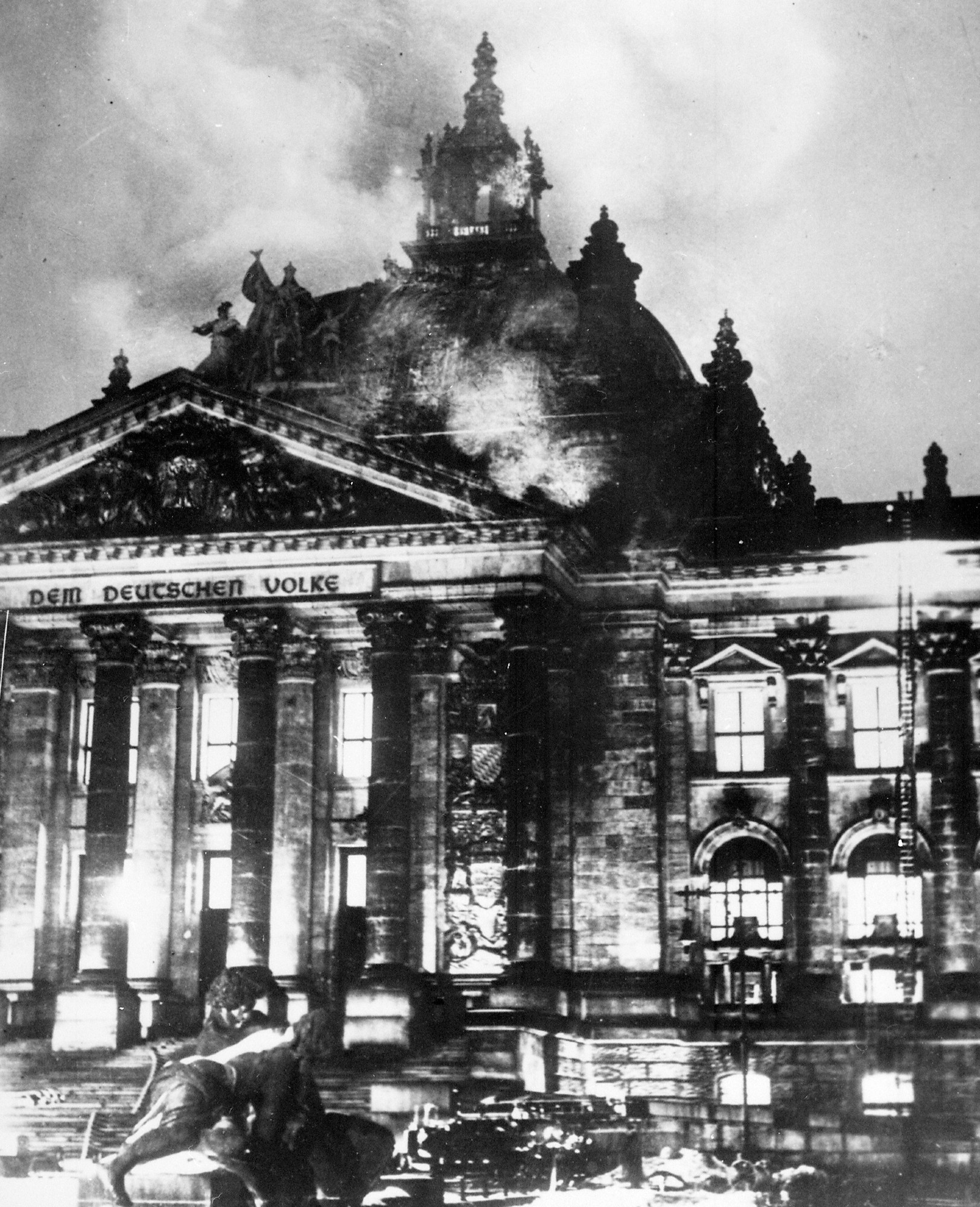 The German Reichstag in flames. Nazis set the fire & blamed the opposition in order to justify their arrests before passage of the Enabling  Act that cemented Hitler's power.