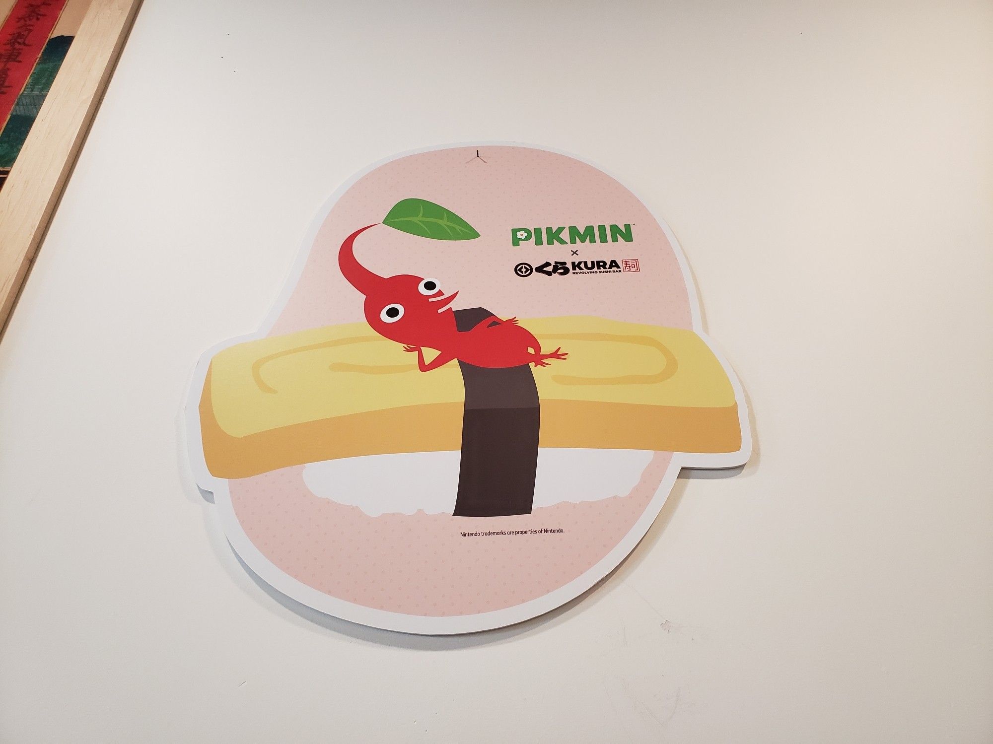 Red pikmin lounging on top of sushi.