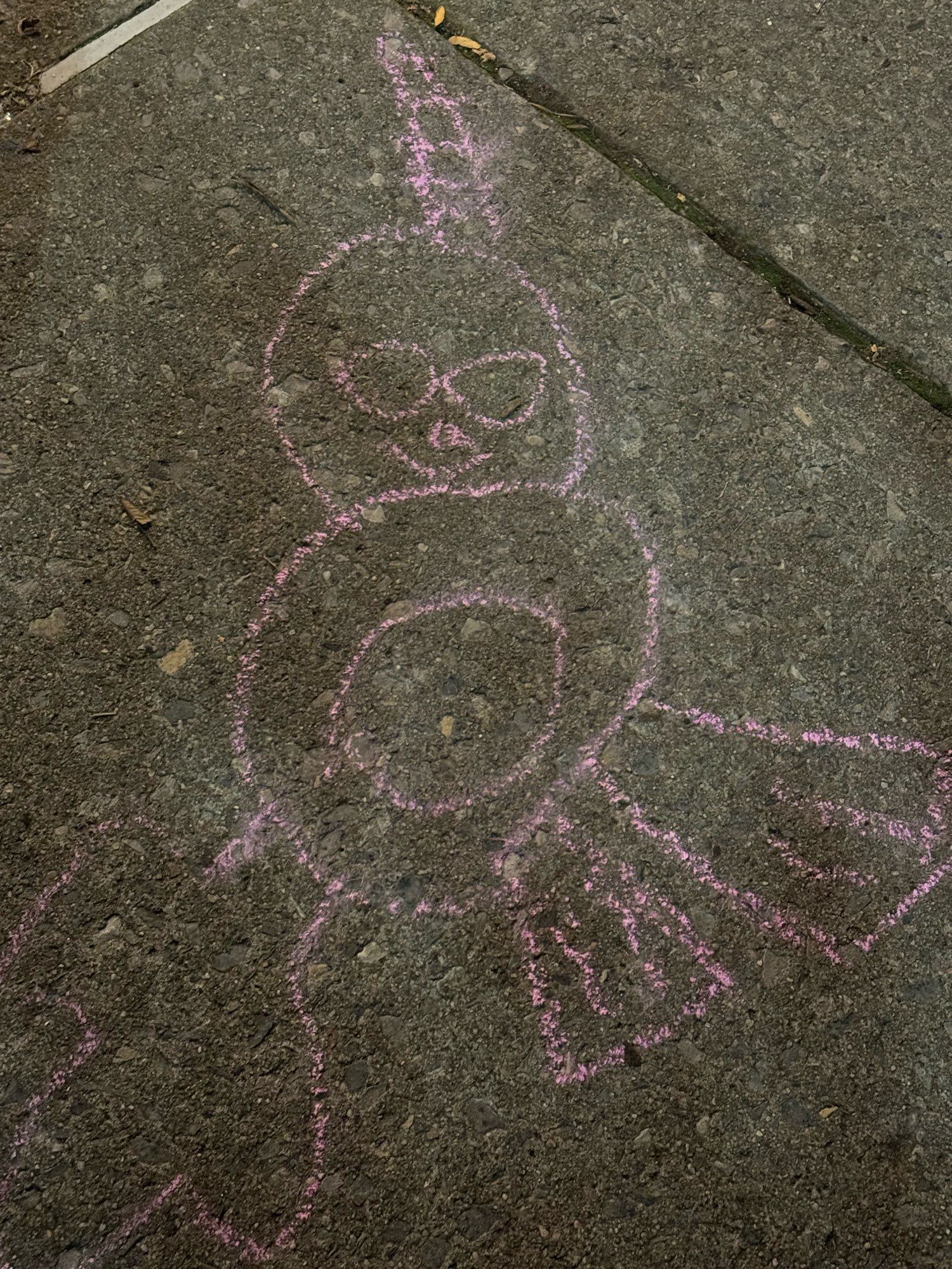 A fun lil unicorn alien in pink sidewalk chalk