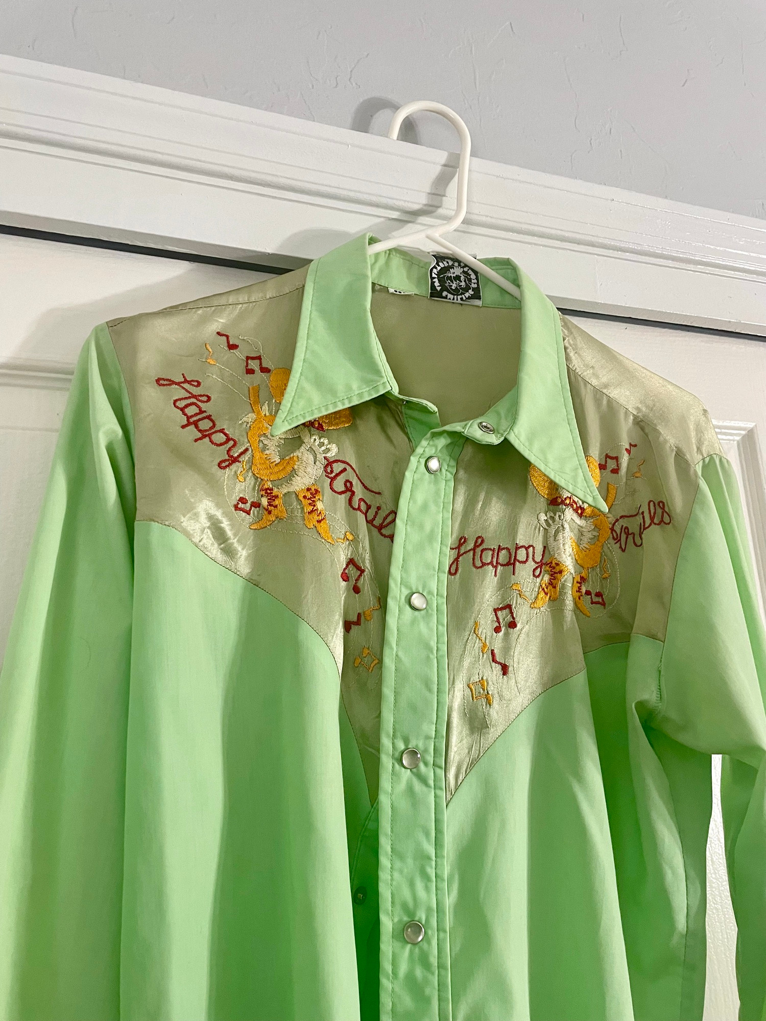 A weird lime greern cowboy shirt that’s clearly from the 1970s. 