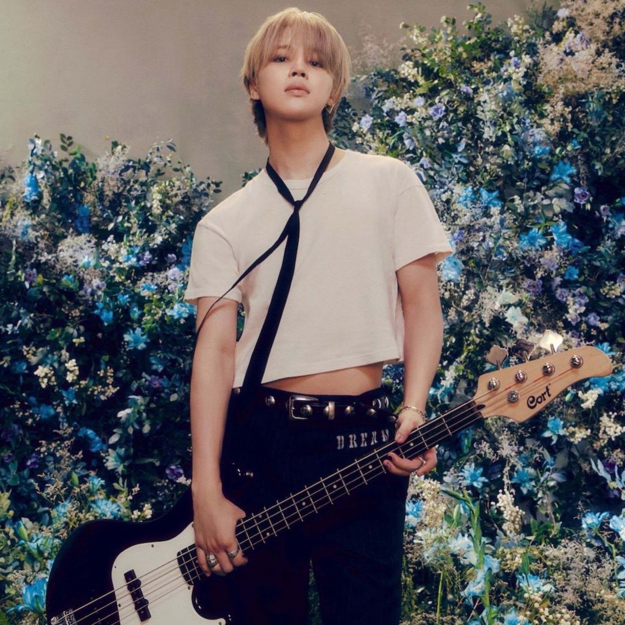 jimin in a crop top holding a guitar