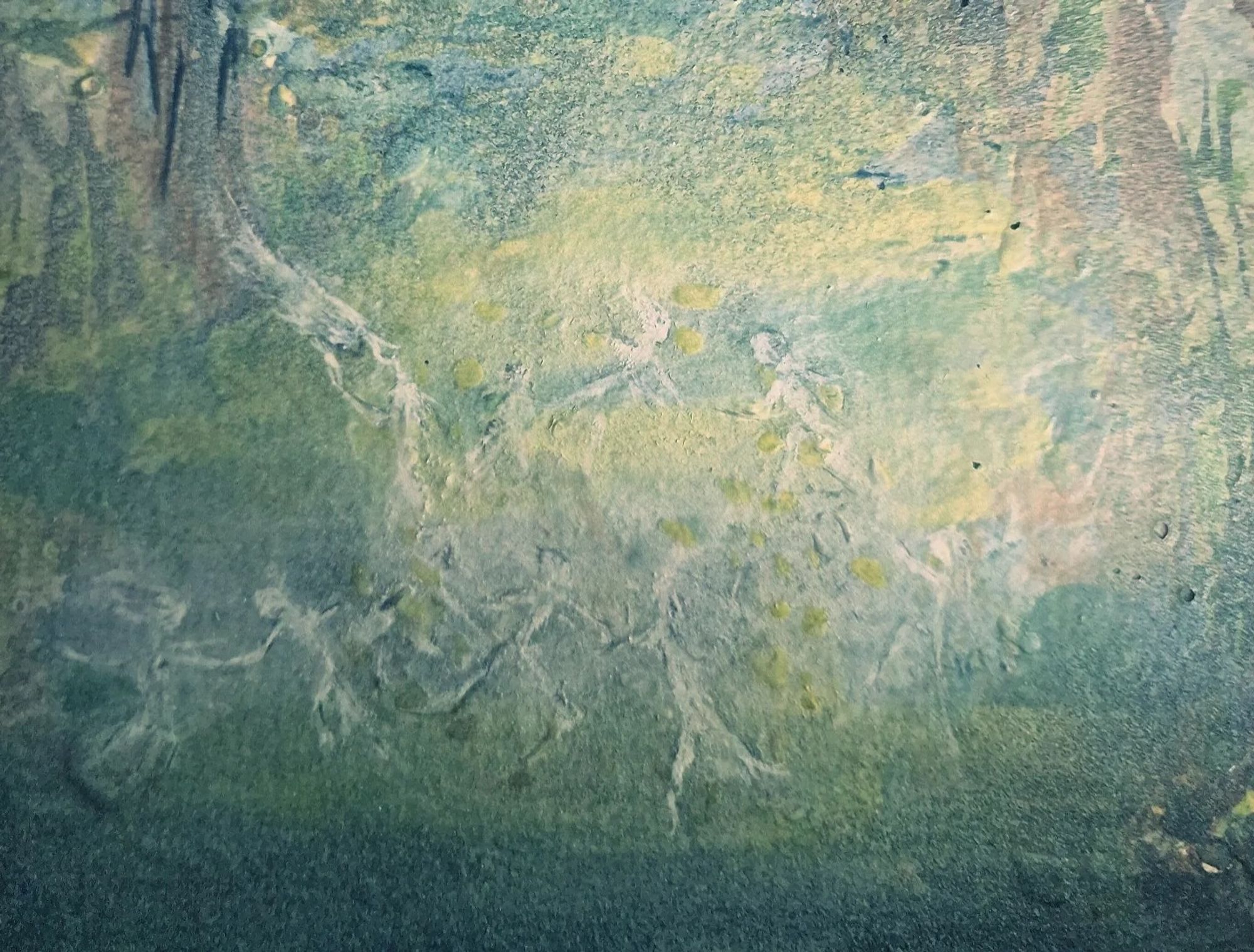 Close up of pale, just-seen misty faery-like figures, dancing and flying about, shrouded in mist.