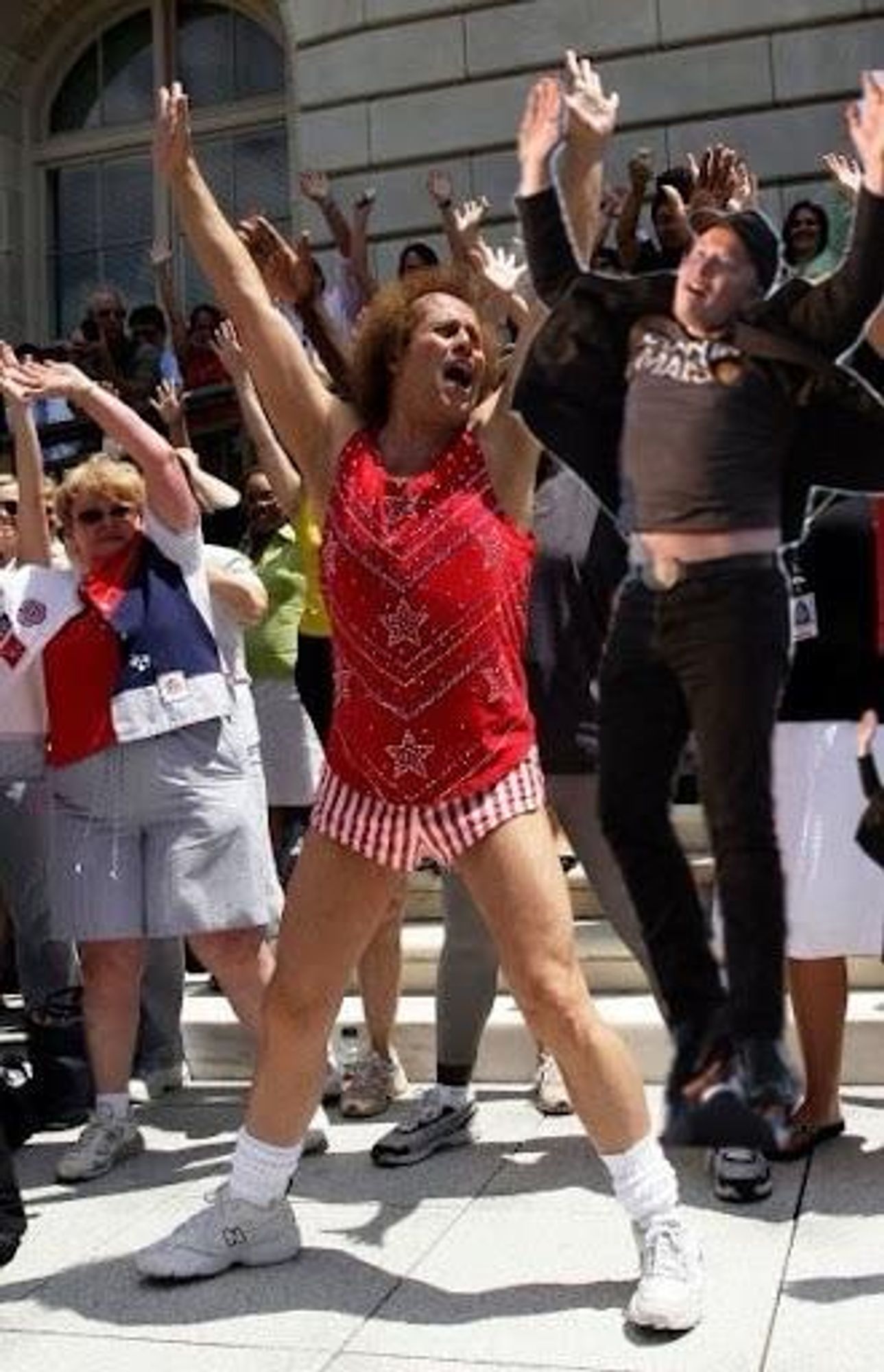 Richard Simmons and crowd exercising with Elon Musk jumping.