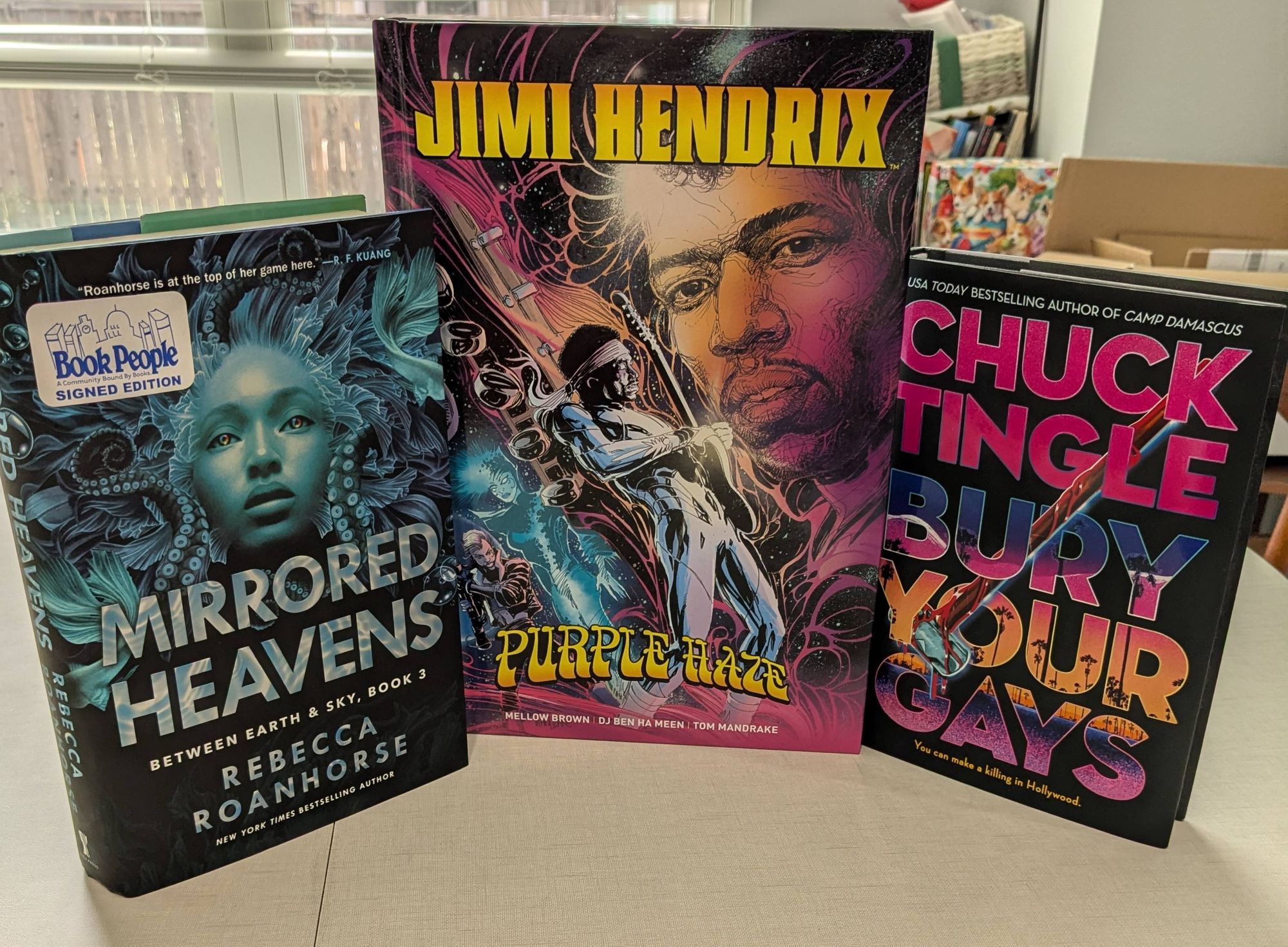 Three new books: Mirrored Heavens, by Rebecca Roanhorse; Jimi Hendrix - Purple Haze, by DJ Ben Ha Meen, Mellow Brown, and Tom Mandrake; and Bury Your Gays, by Chuck Tingle