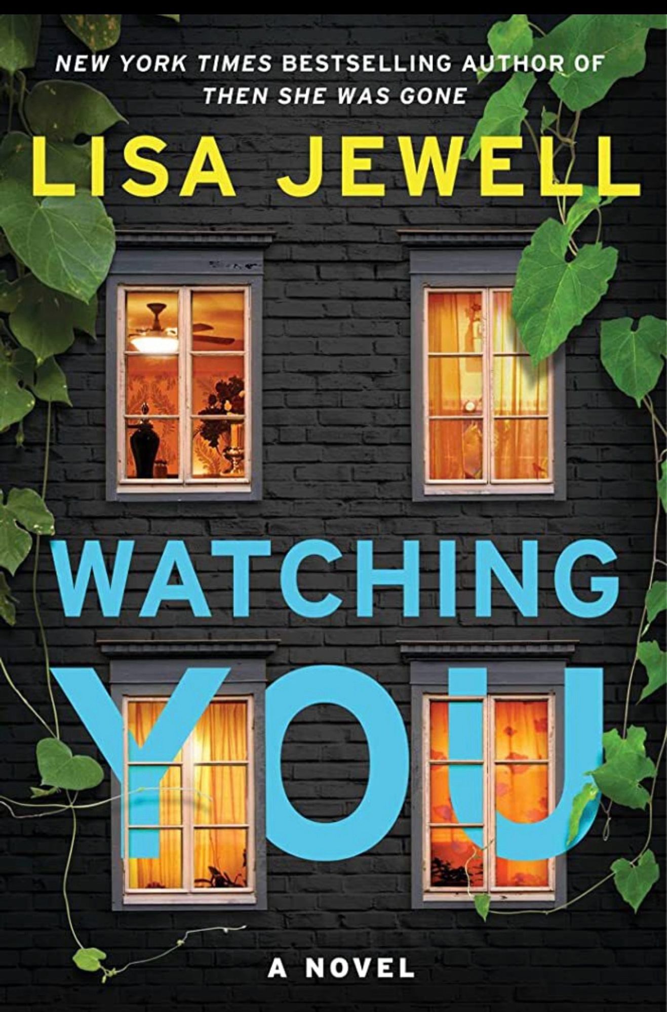 The front of a house with the lights on I all four windows. Book cover for WATCHING YOU by Lisa Jewell.