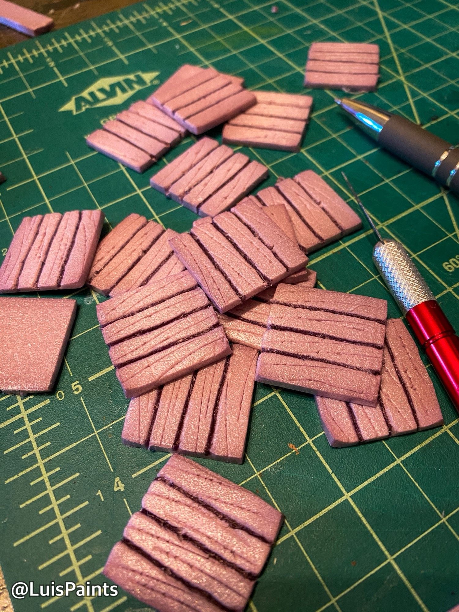 Pink XPS foam cut into small thing squares to resemble wood flooring