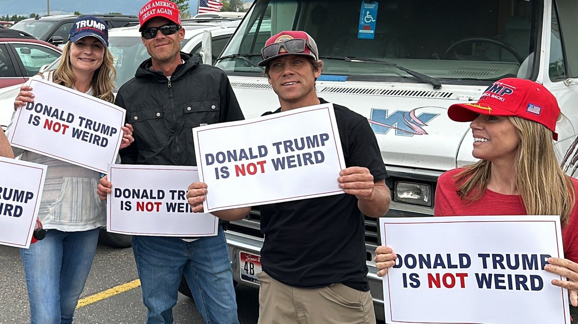 A bunch of weirdos in maga hats holding up signs that say "Donald Trump is not weird"