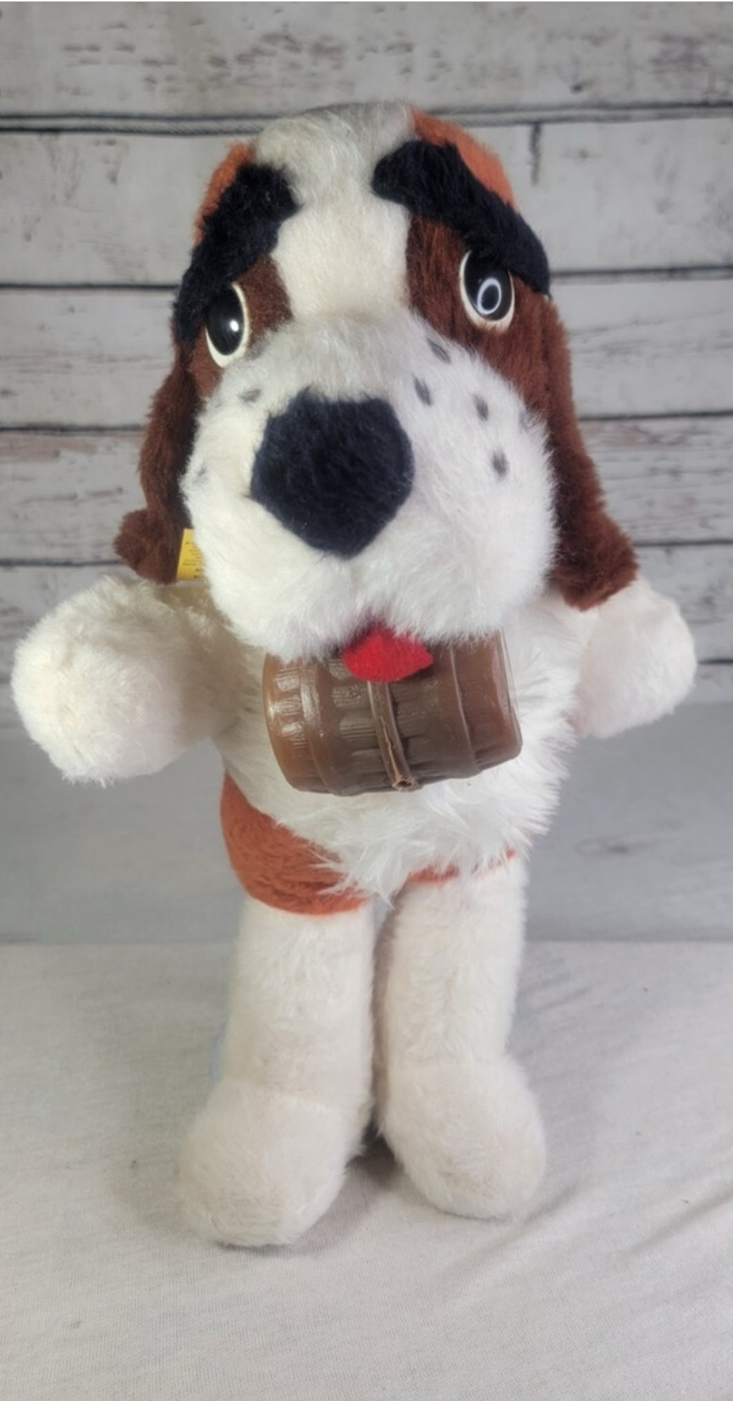 Image (downloaded from EBay) of a carnival prize from the 1970s that supposed to be a Saint Bernard dog wearing a brandy cask around its neck.