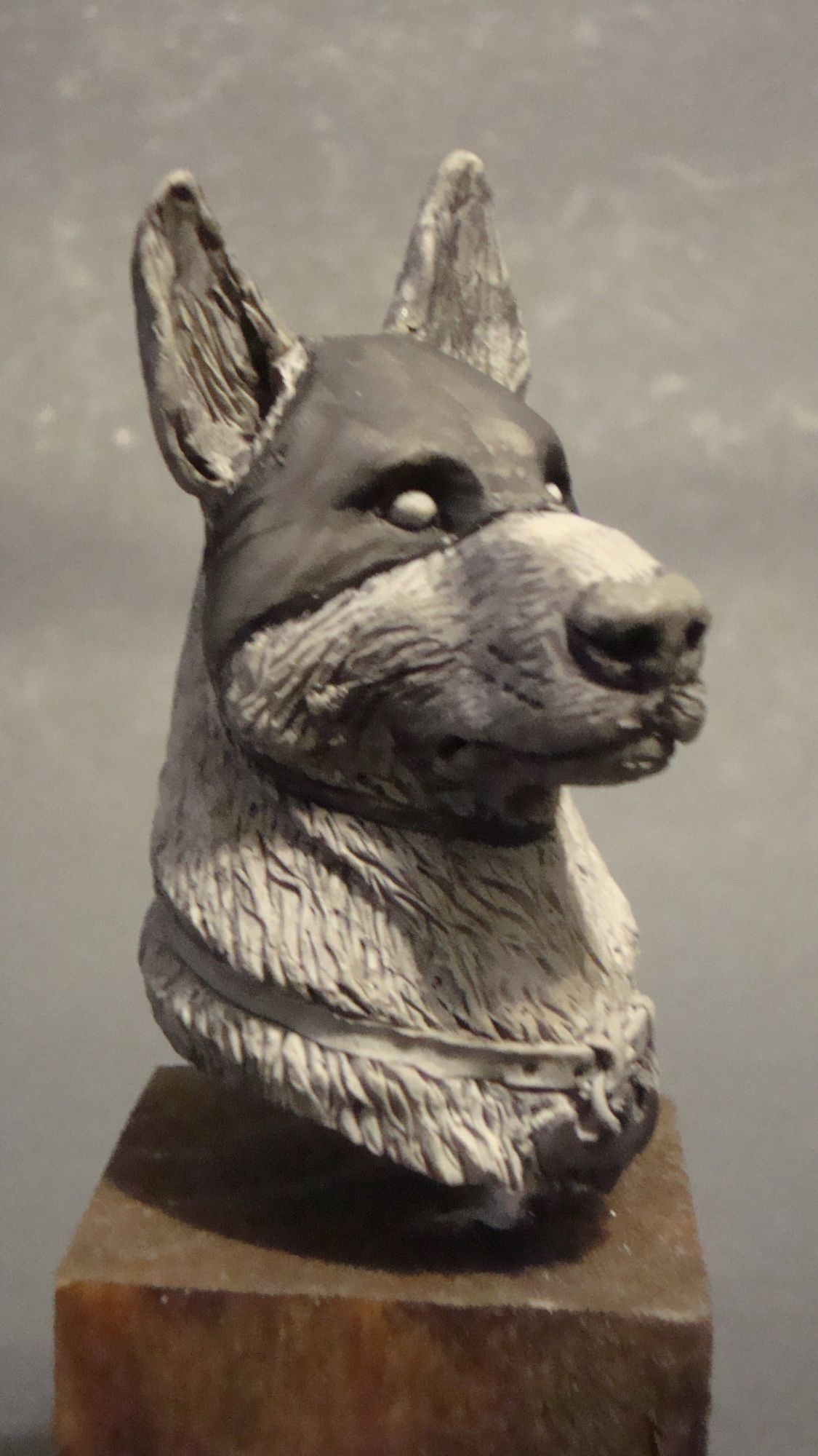 Minibust of Ace the Bathound, a German Shepherd in a mask, right 3/4 view, mounted on a wooden cube