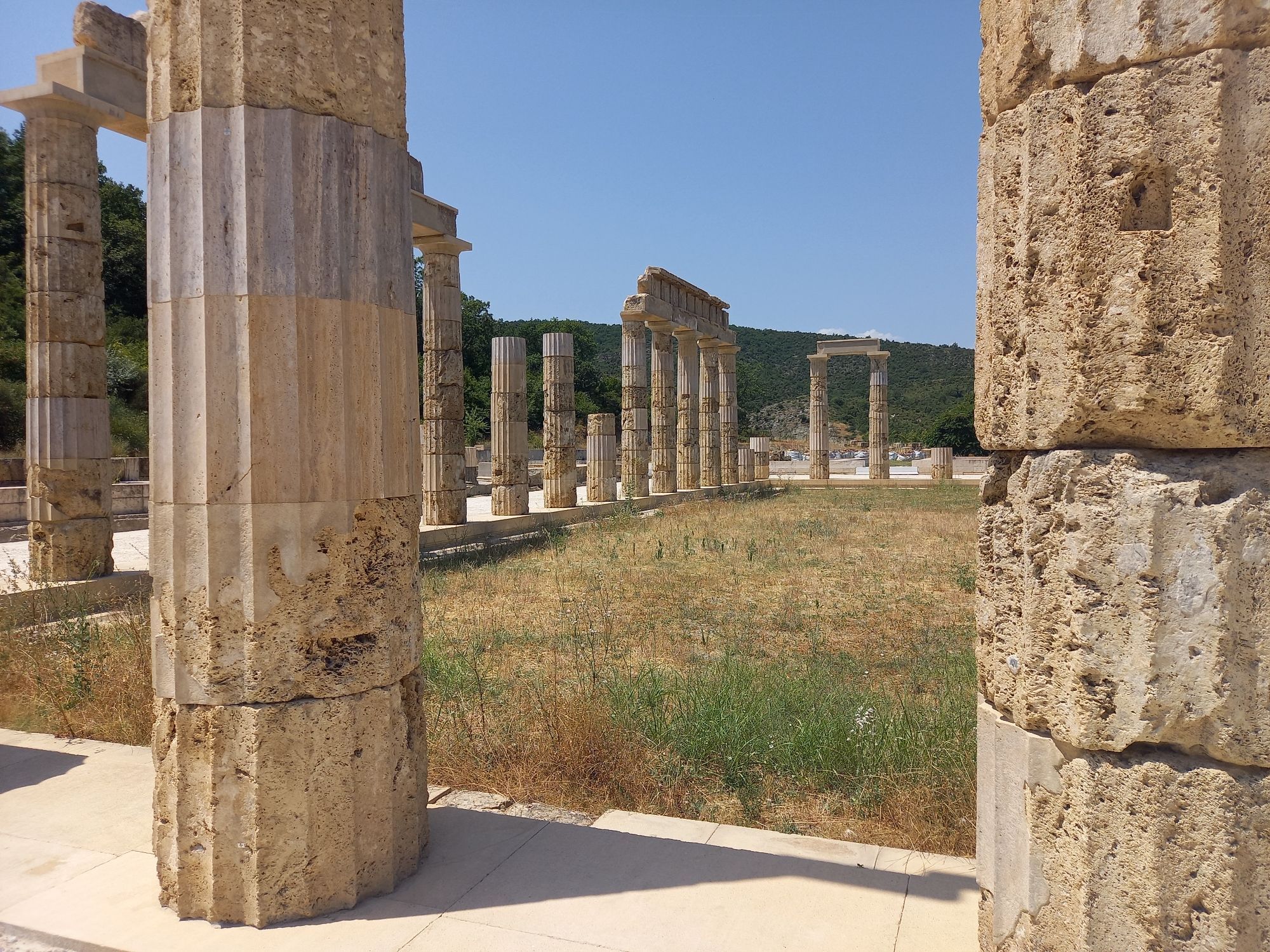 View of a row of columns, seen through two columns in the foreground, at the site of the ancient palace of Aigai (Vergina).