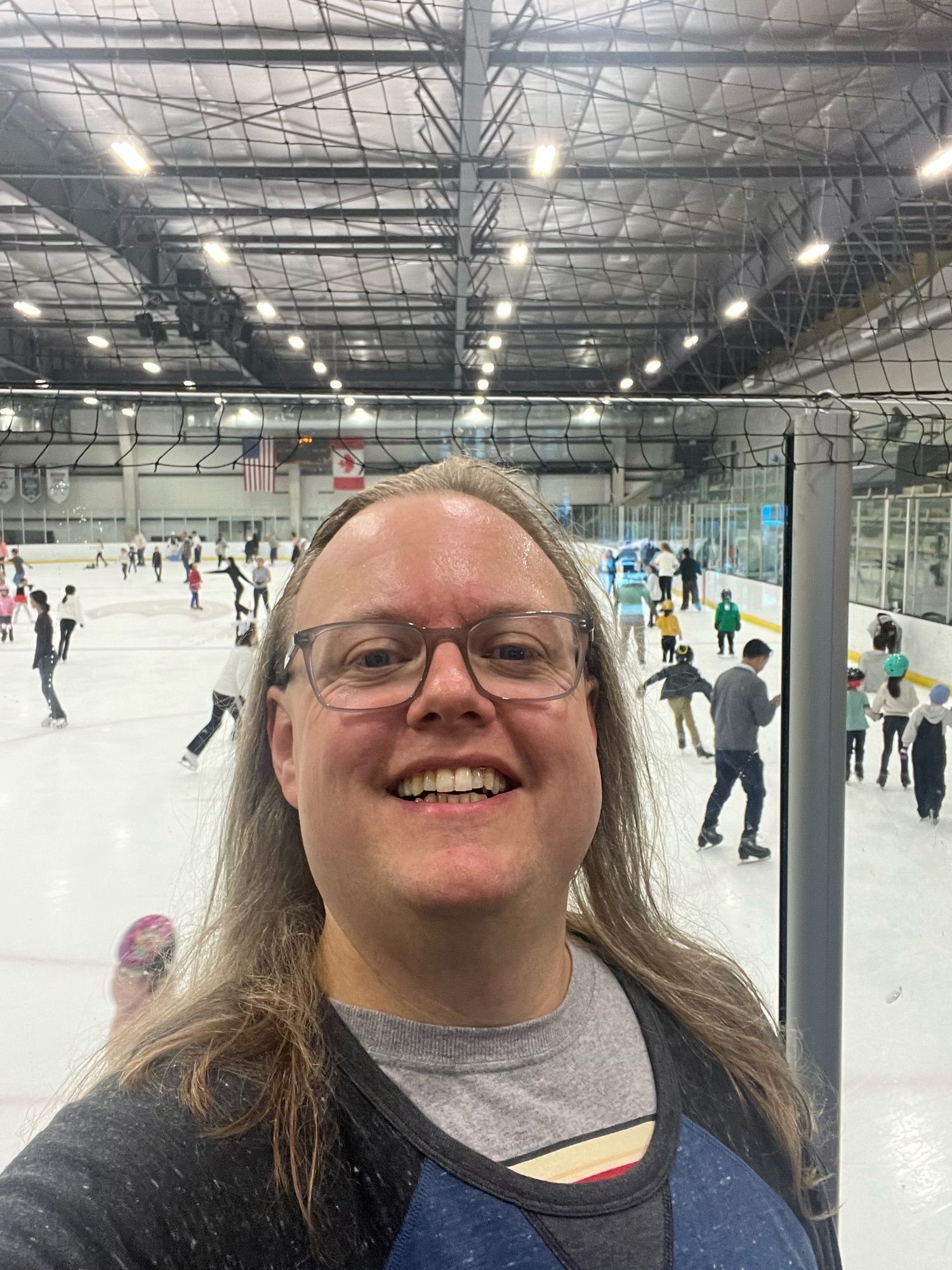 me, for once, at a hockey rink having been skating for the first time in 20+ years