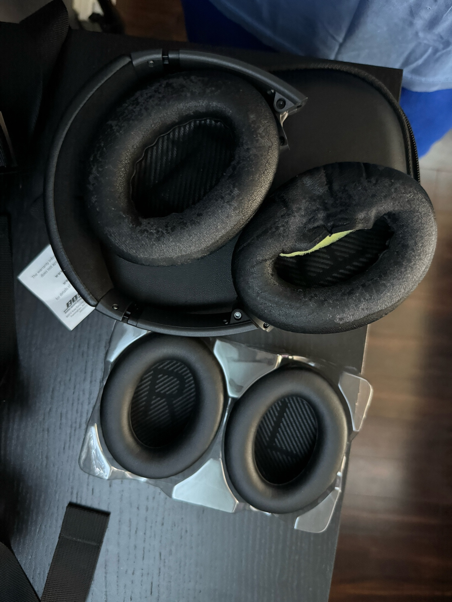 Old deteriorating ear cups on Bose headphones and new replacement ones