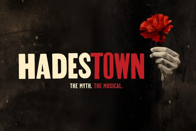 Hadestown logo: Hadestown The myth. The musical. 
Next to the writing is a hand holding a red flower.