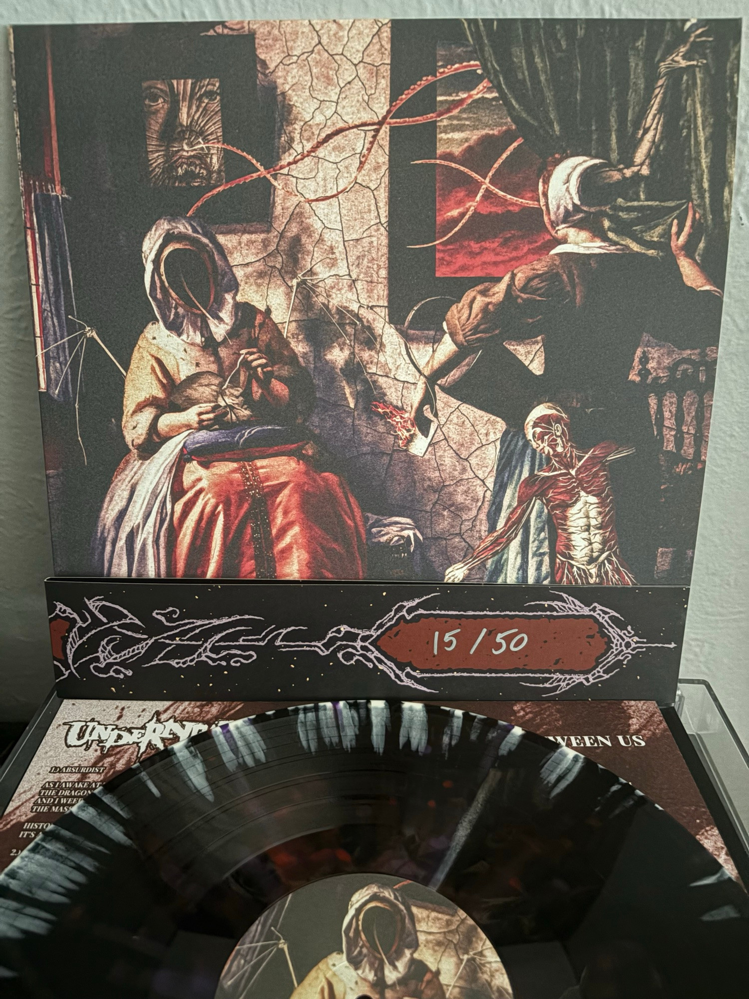 Underneath “It Exists Between Us” vinyl lp and jacket 