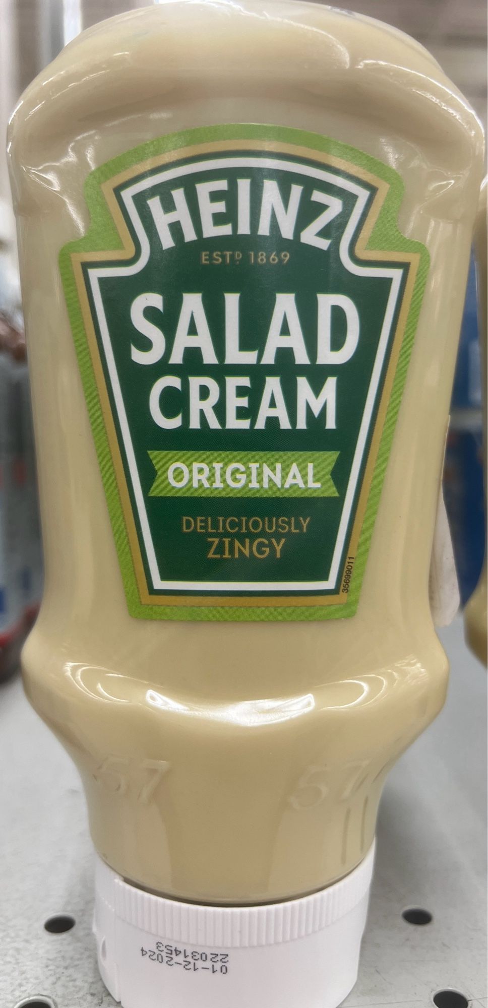 A plastic bottle of Heinz “Salad Cream”, which is pea soup green colored.