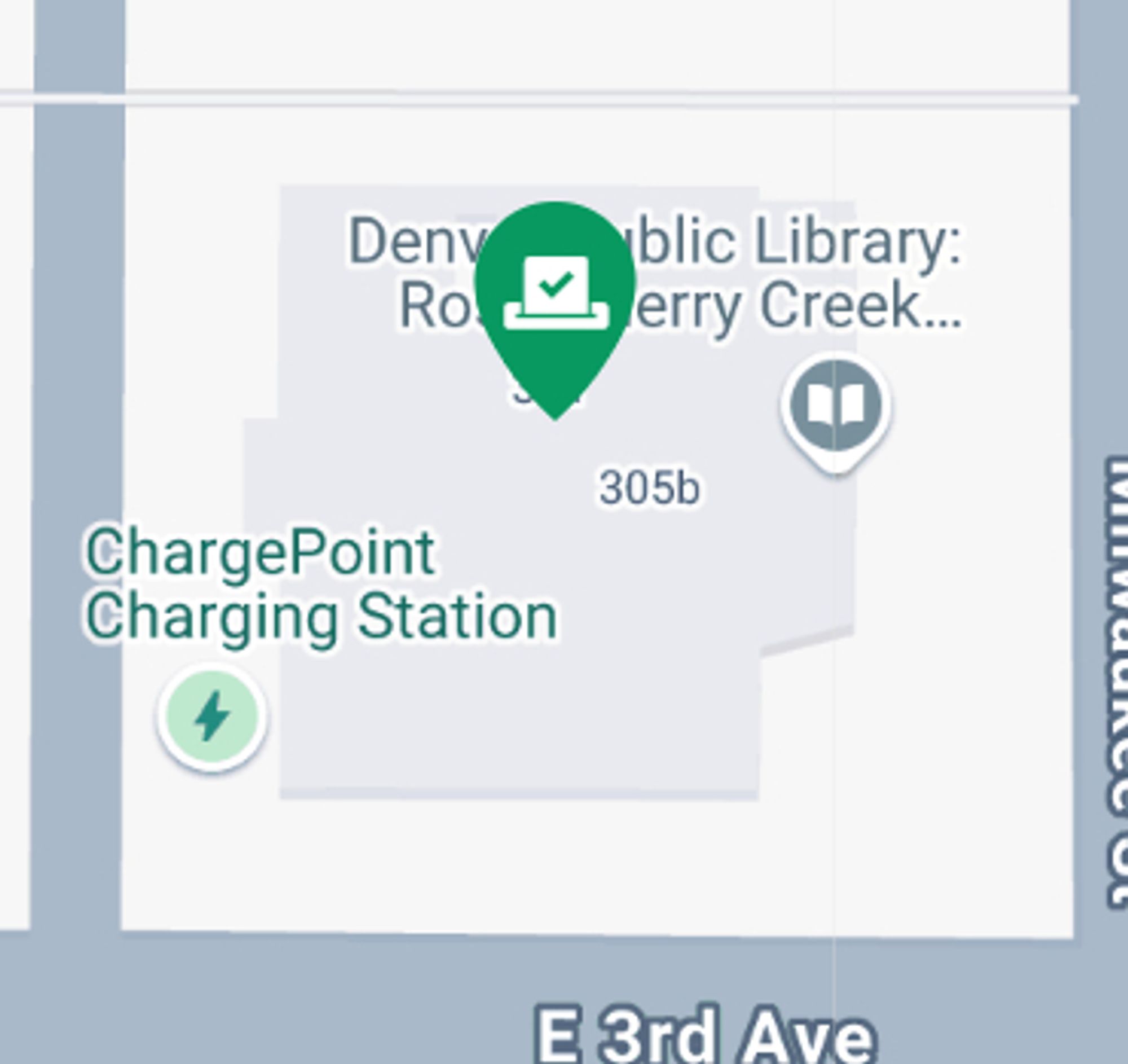 A snippet of a map showing a library building outline with a green ballot box indicator at the center of the building.