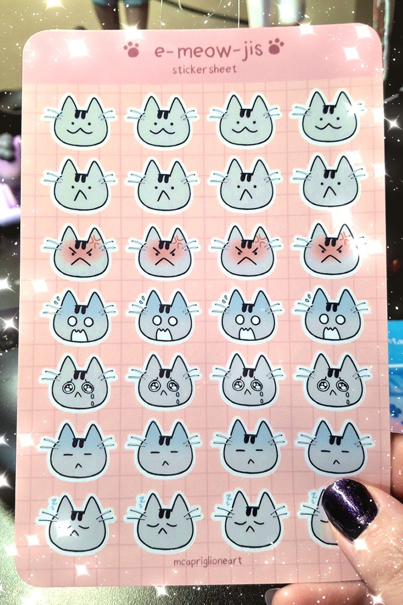 sticker sheet preview featuring 28 stickers of different cat faces.