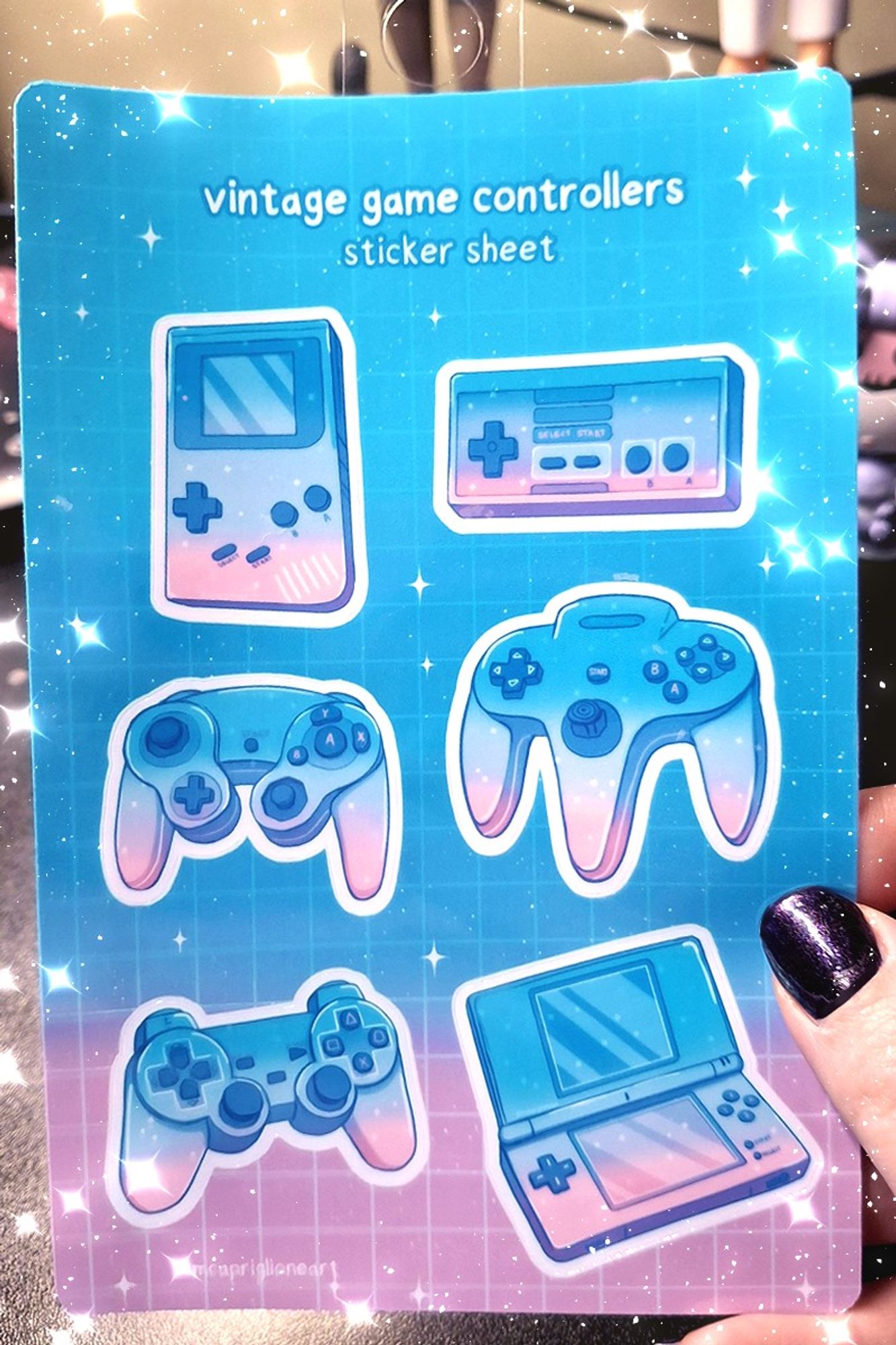 preview of a 4x6 sticker sheet with 6 different designs of vintage controllers in a blue/pink color scheme.