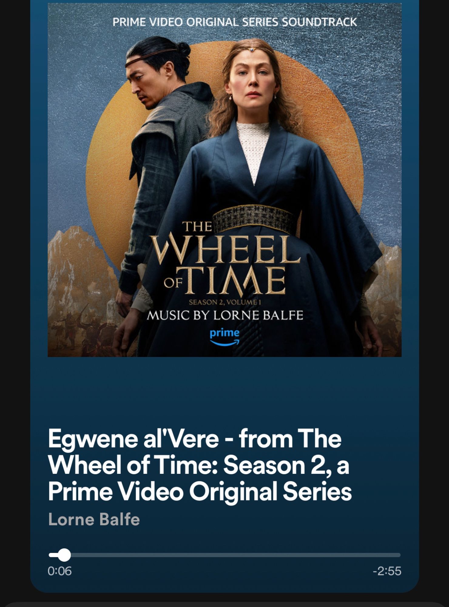 A screenshot of the song Egwene al’Vere playing from the Wheel of Time Season Two soundtrack. The album cover is the poster of Moiraine in her blue dress looking through your soul with Lan standing behind her looking down and to the left.