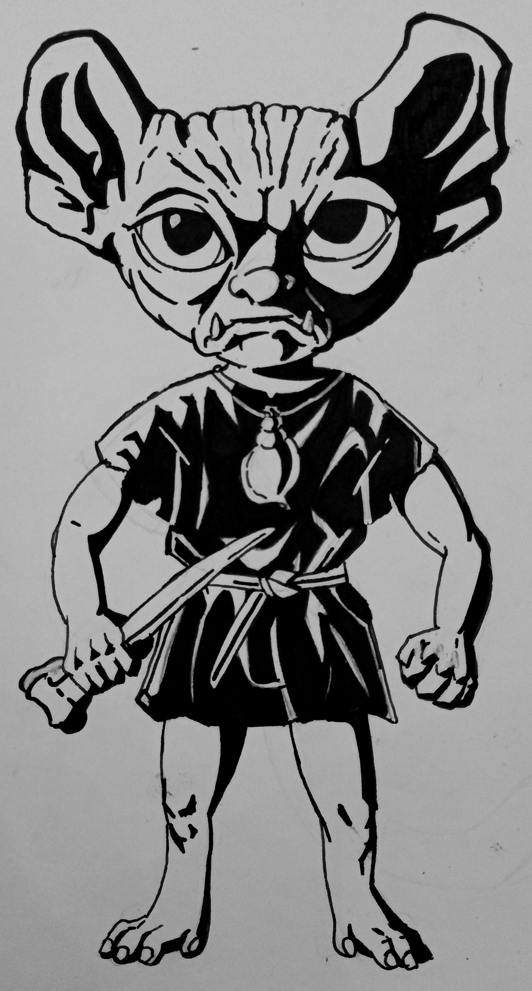 A scowling goblin wearing a tunic and shell necklace and clutching a bone weapon.