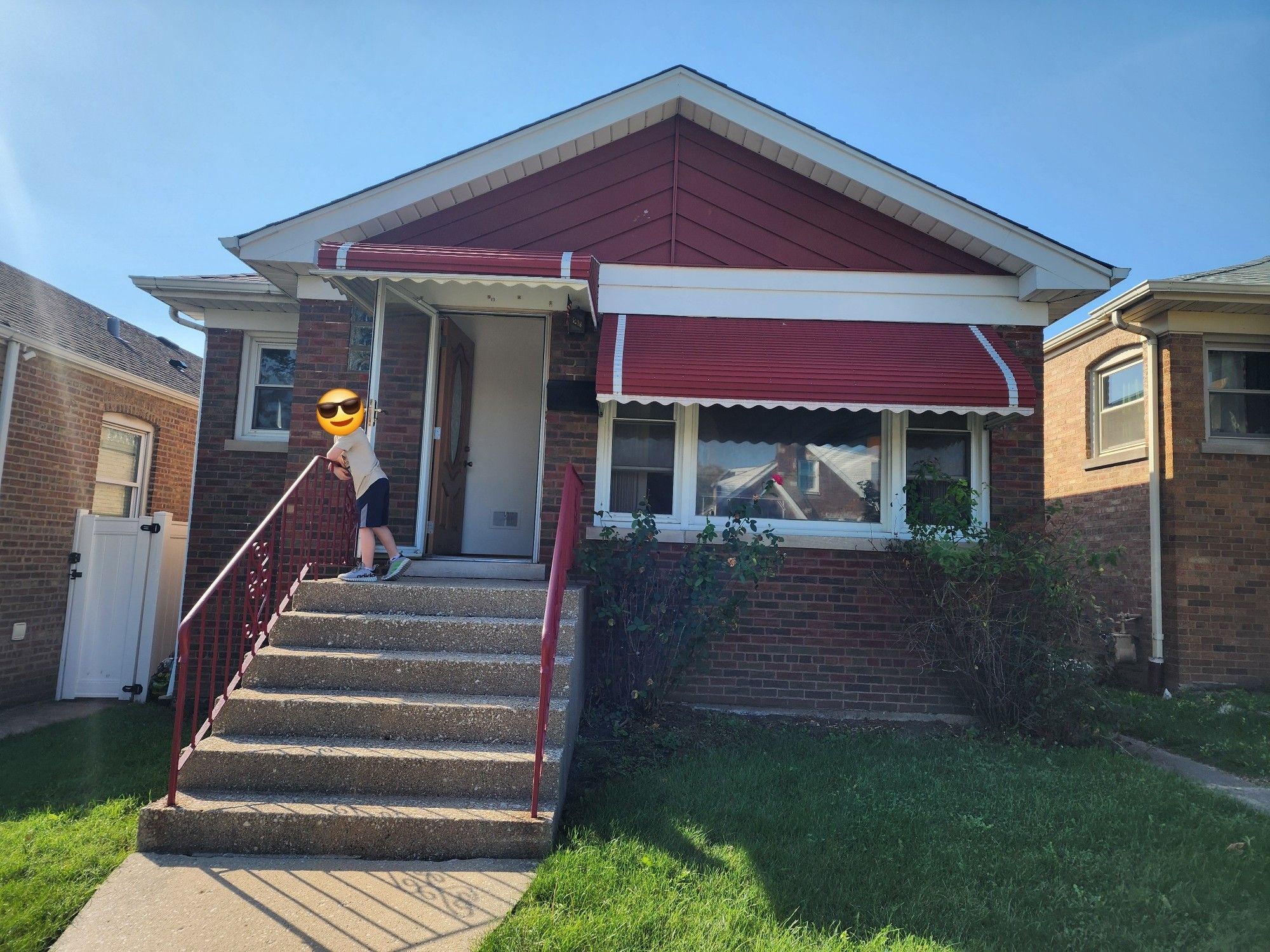 A typical Chicago bungalow, with a helpful 7 year old holding the front door open.