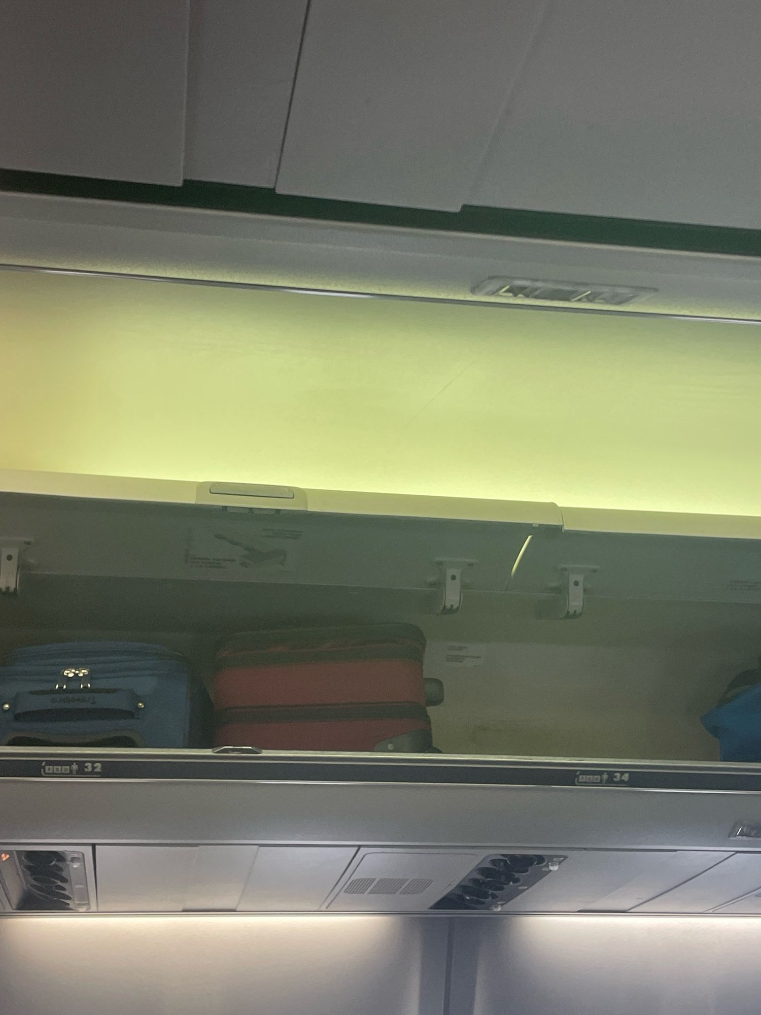 Picture of aisle markers in plane showing rows 32 and 34.  There is no row 33.