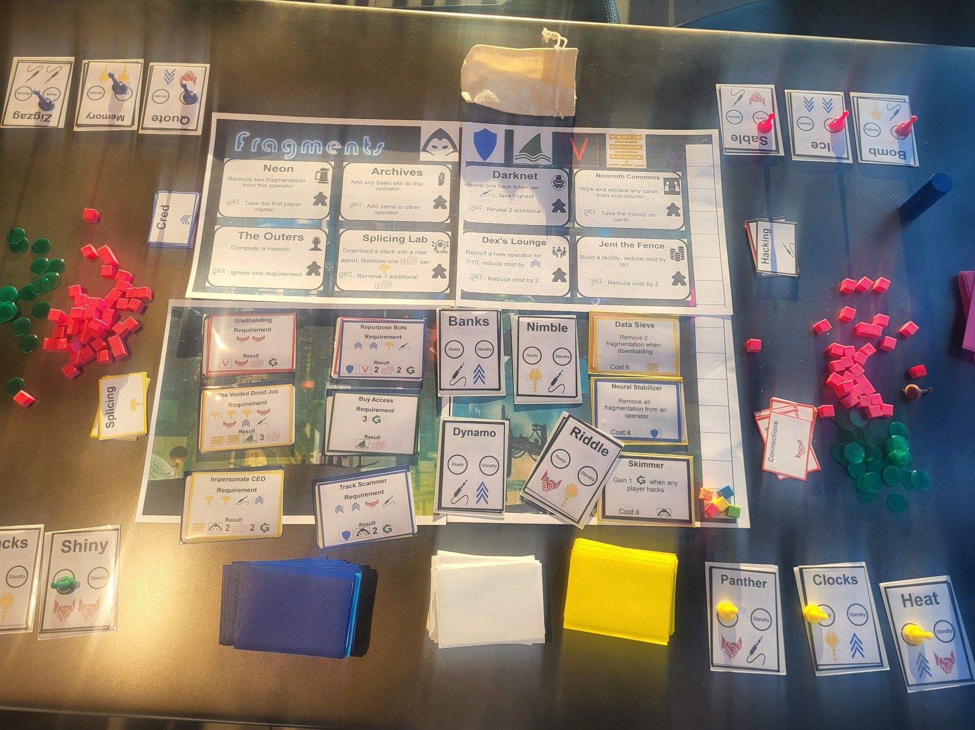 Wide shot of 'Fragments' prototype. Lots of cards, cubes, and chips