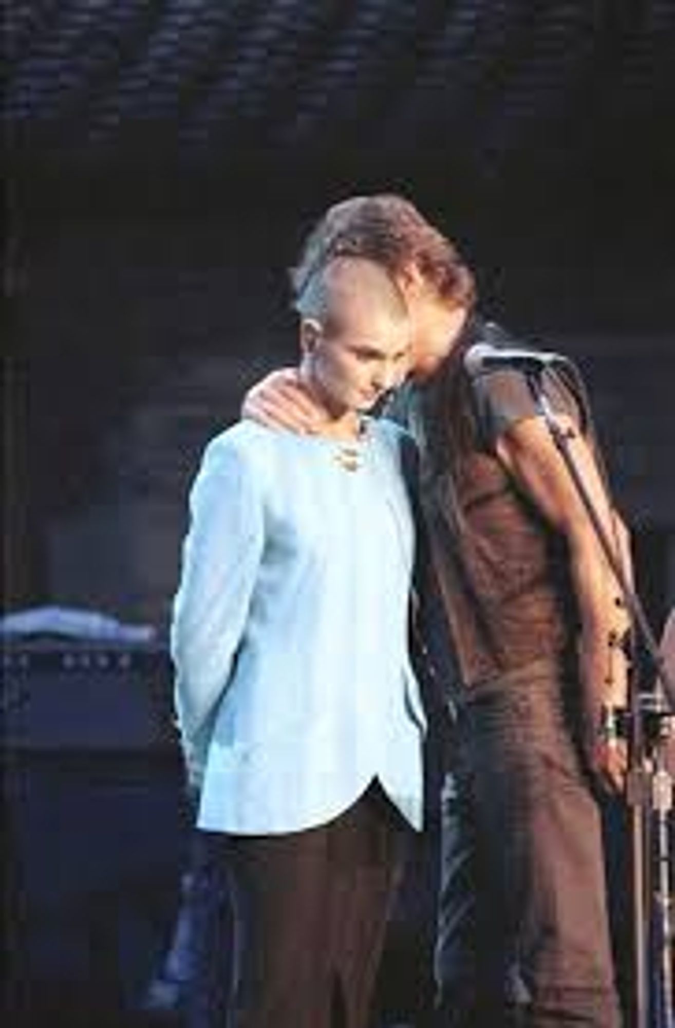 Kris Kristofferson whispering into Sinead o'connor's ear