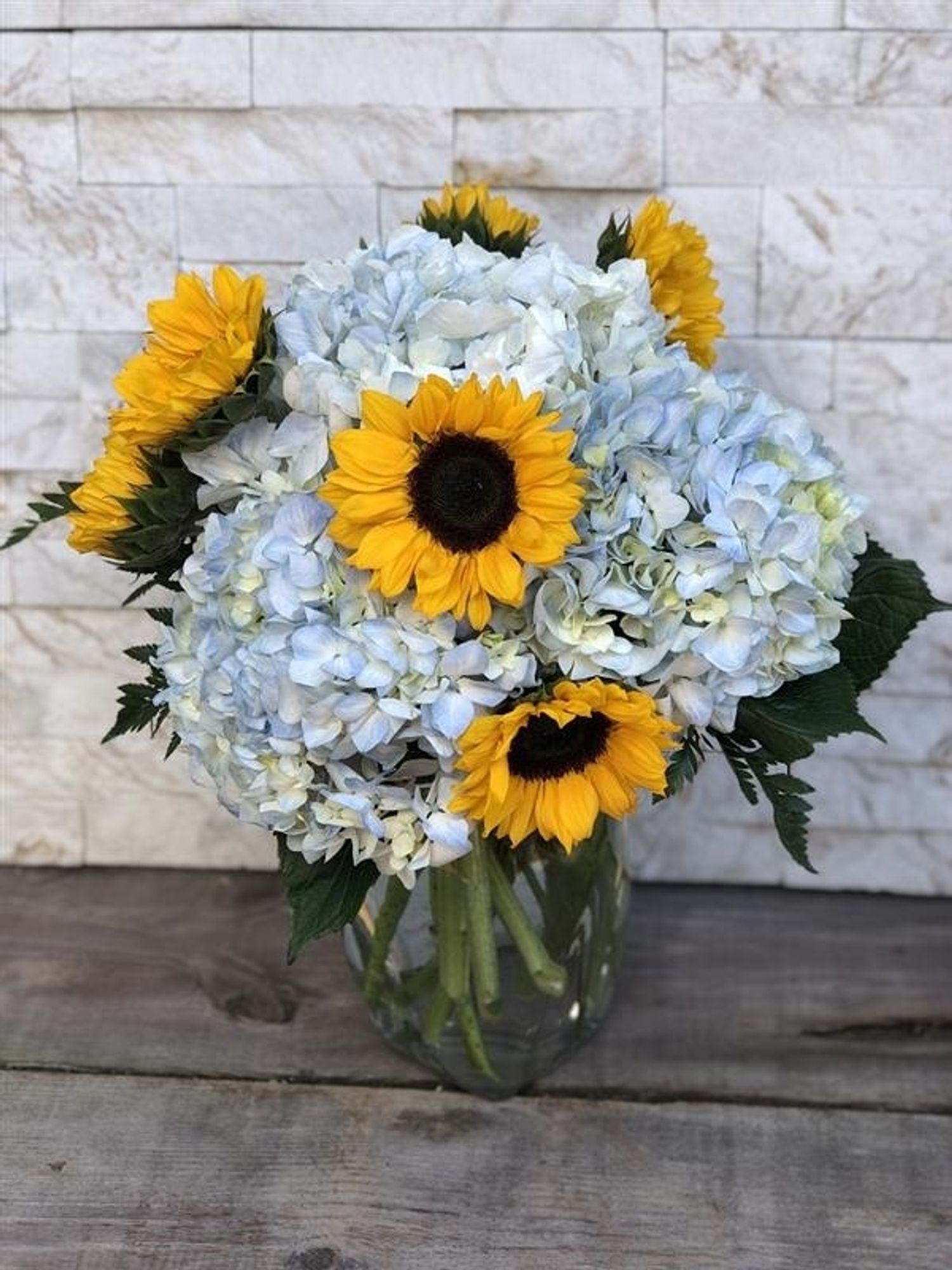 Sunflower and blue hydrangea bouquet