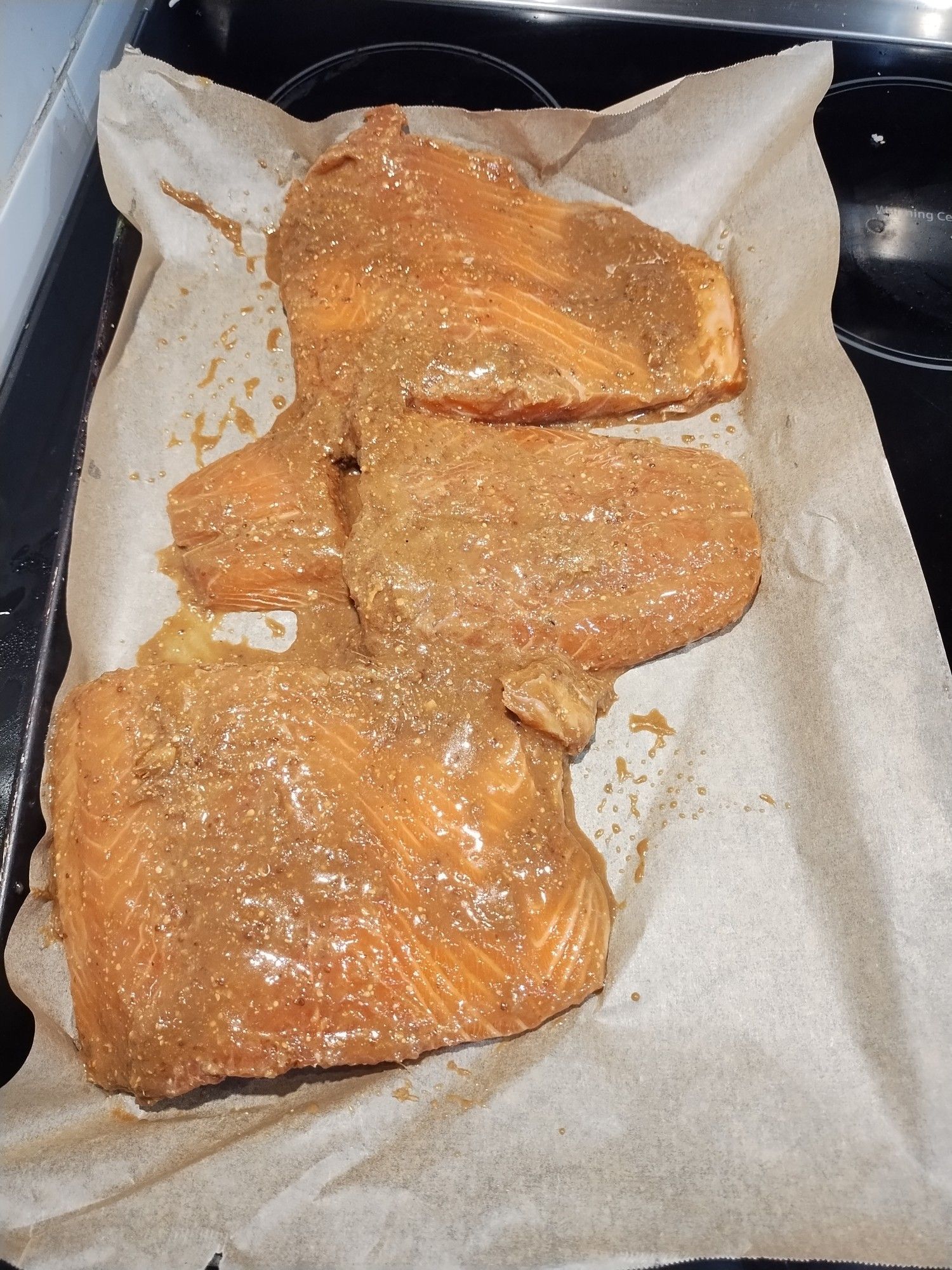 Salmon on a baking sheet. It has been marinated