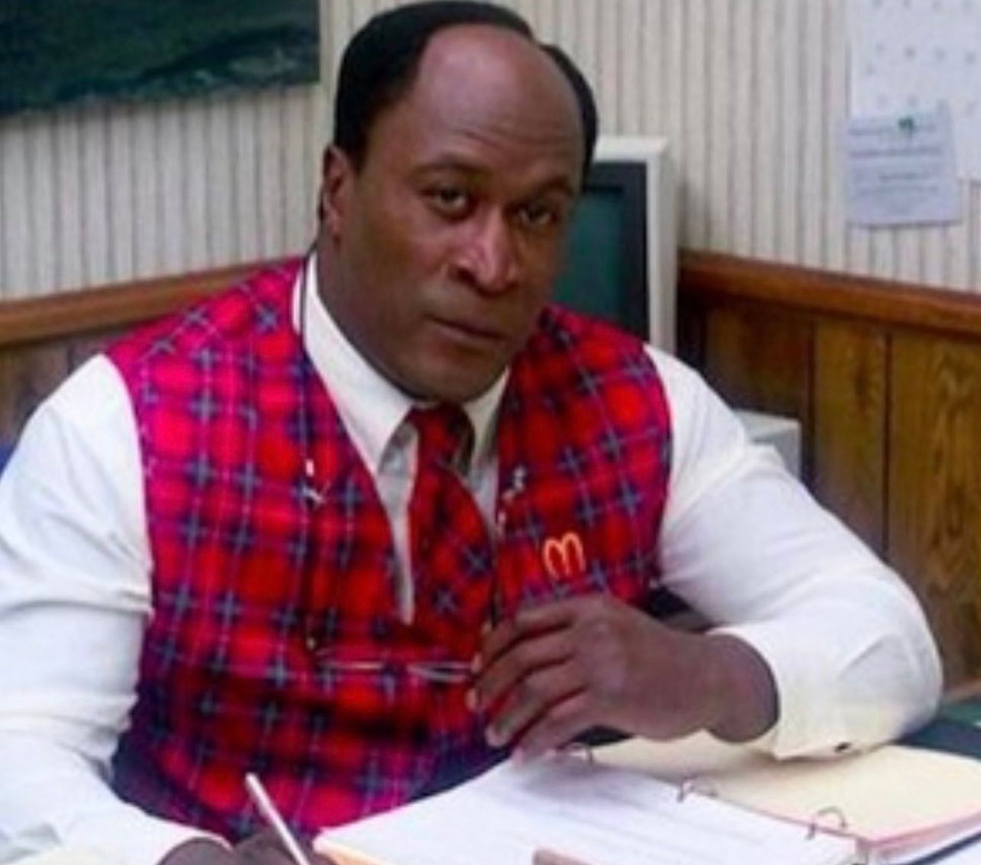 John Amos as fast food entrepreneur Cleo McDowell, in Coming to America.