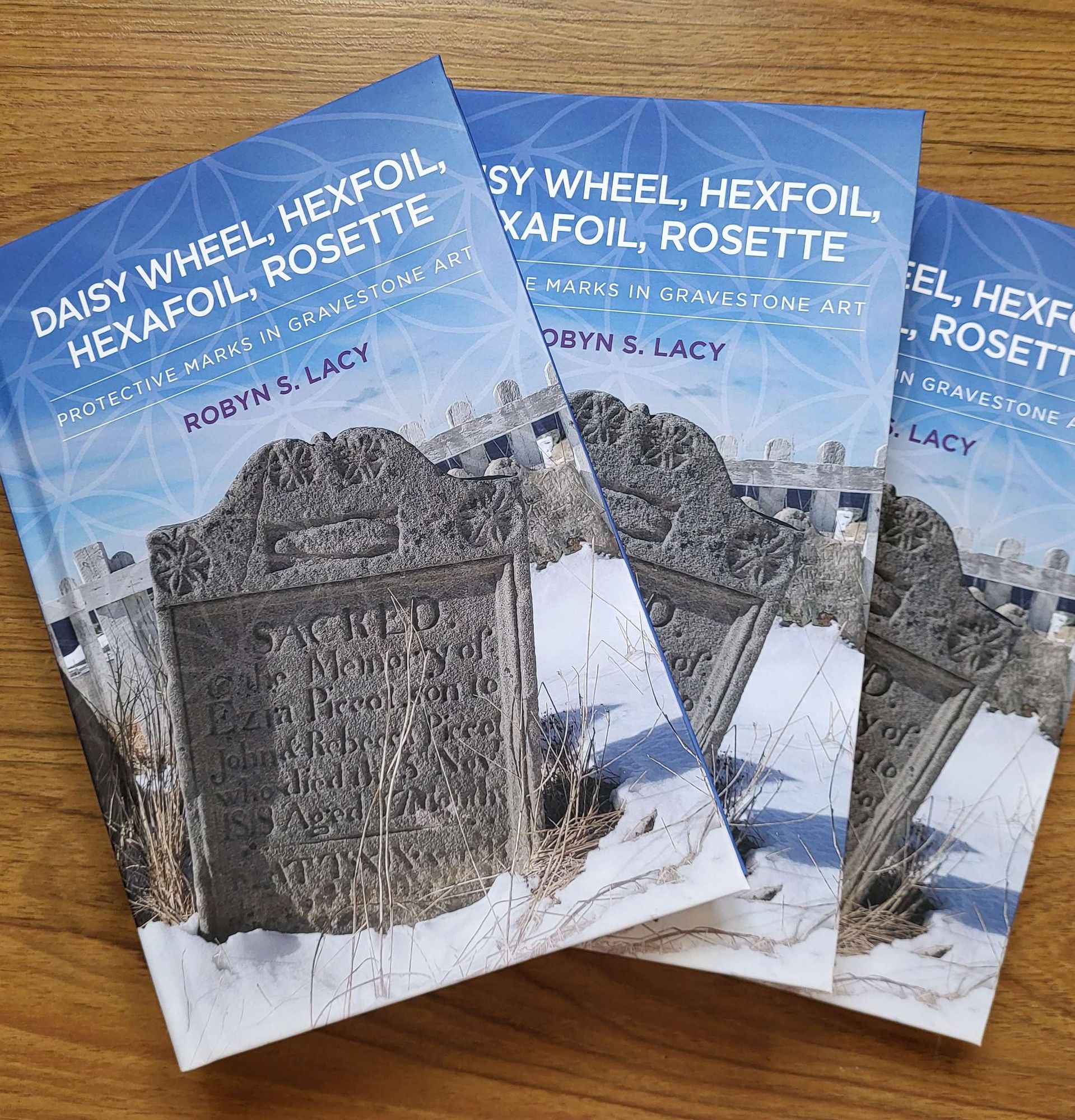 Three copies of my new book, 'Daisy Wheel, Hexfoil, Hexafoil, Rosette', spread out across a table. It's a giveaway!