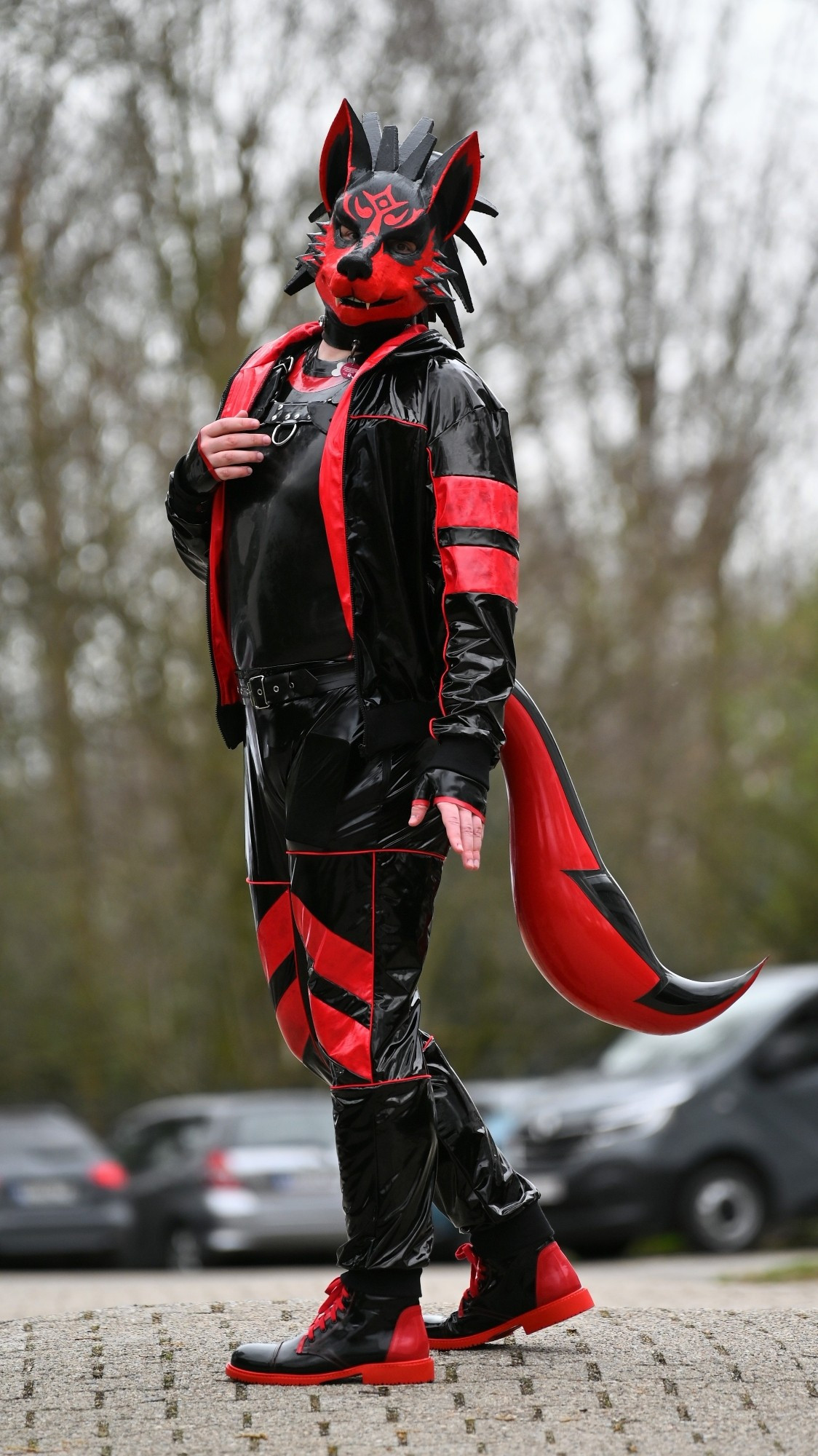 Wolf rubber mask with rubber suit and pvc tracksuit over it