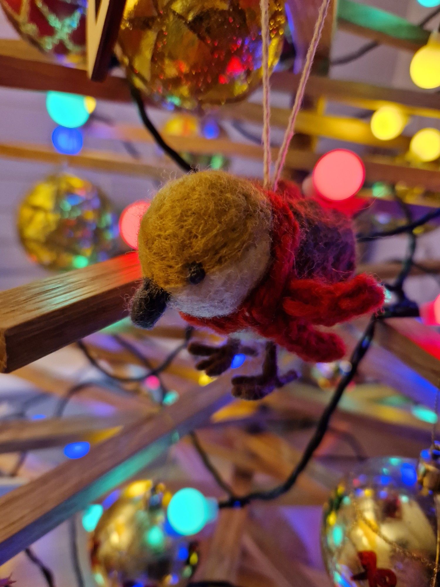 Felt sparrow Christmas decoration. He's got a scarf on.