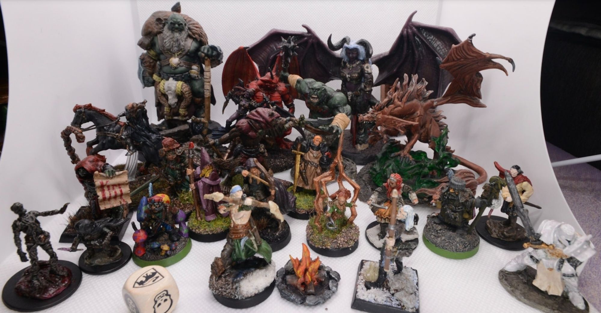 Many minis including an ogres, demons, a dragon vampire, headless horseman various player characters