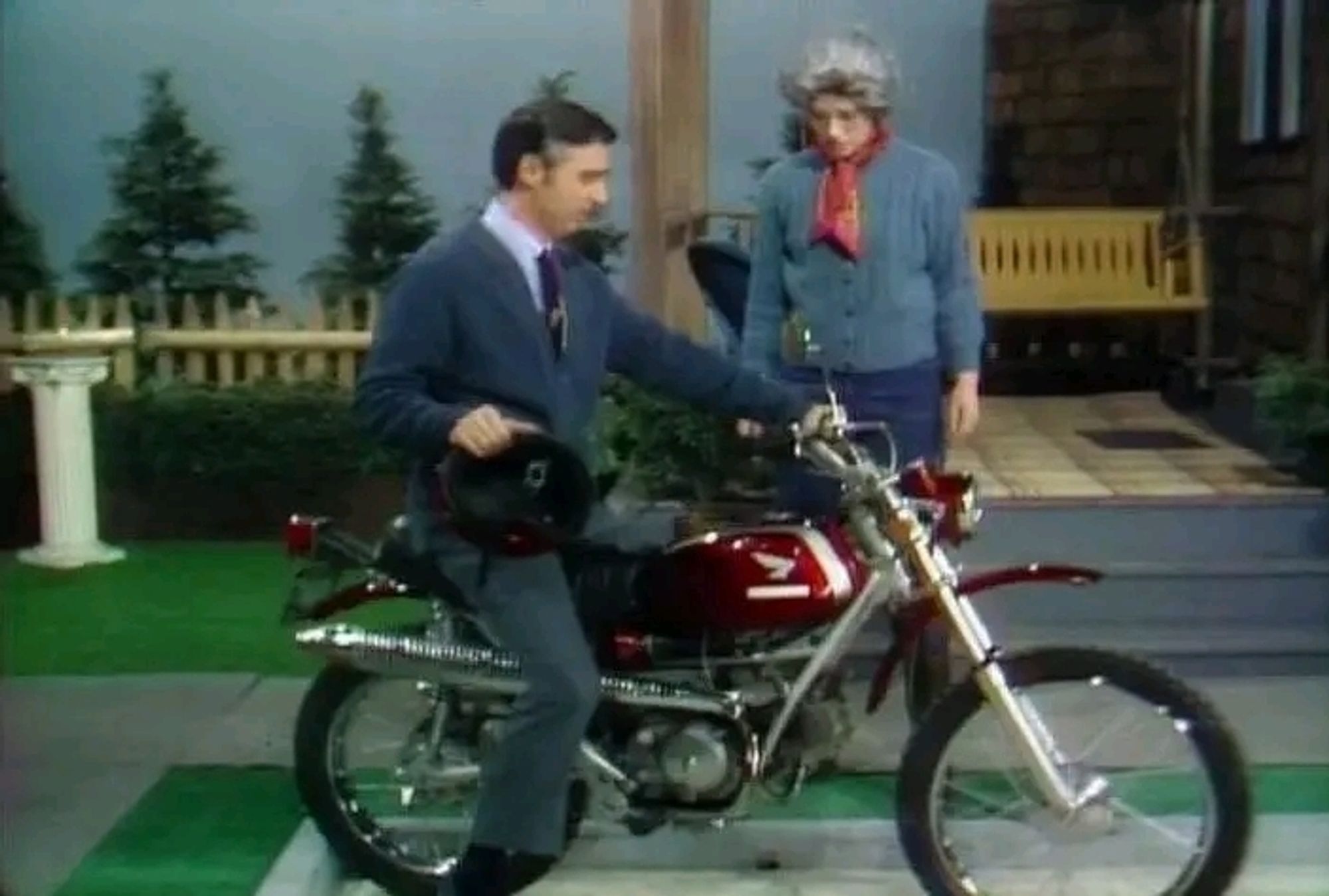 Mr Rogers on a motorcycle.