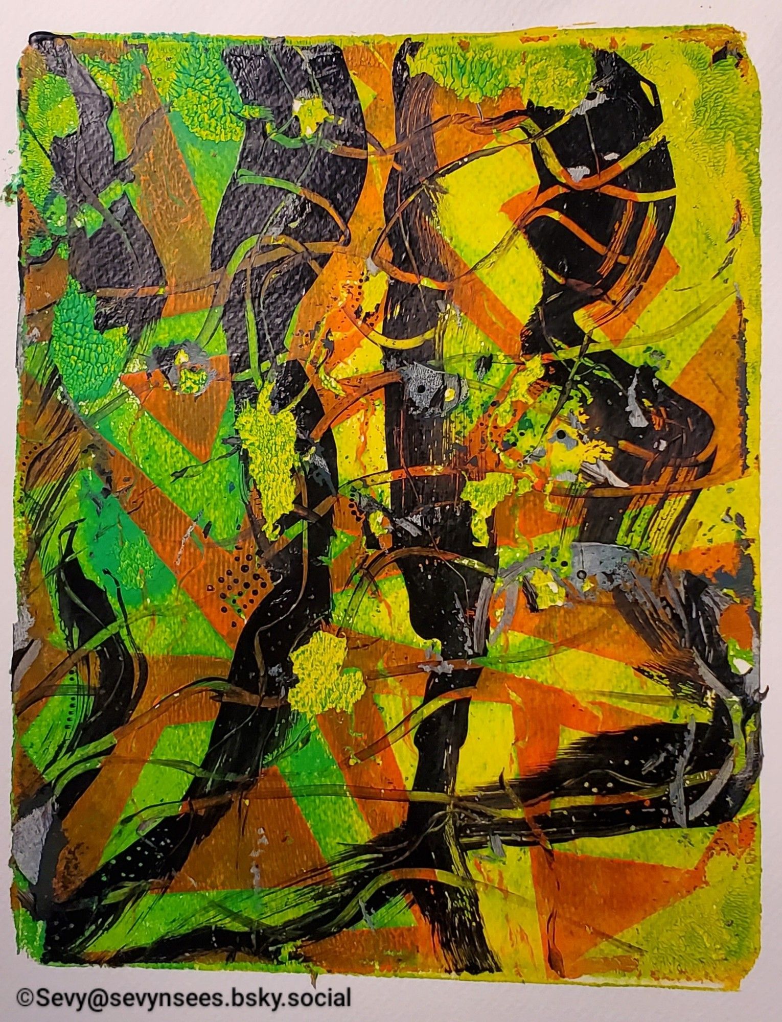 An abstract gel print with black, yellow, green and orange acrylic paint.